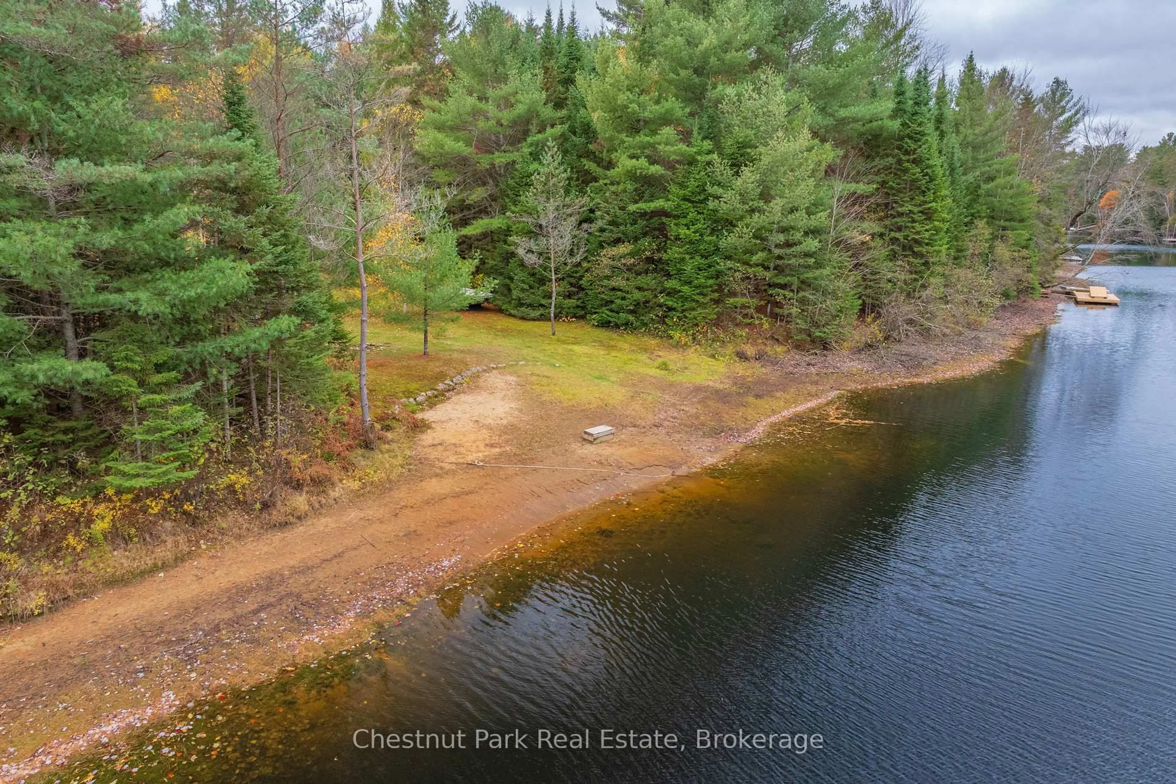 A pic from outside/outdoor area/front of a property/back of a property/a pic from drone, water/lake/river/ocean view for 529 Balsam Chutes Rd, Huntsville Ontario P0B 1L0