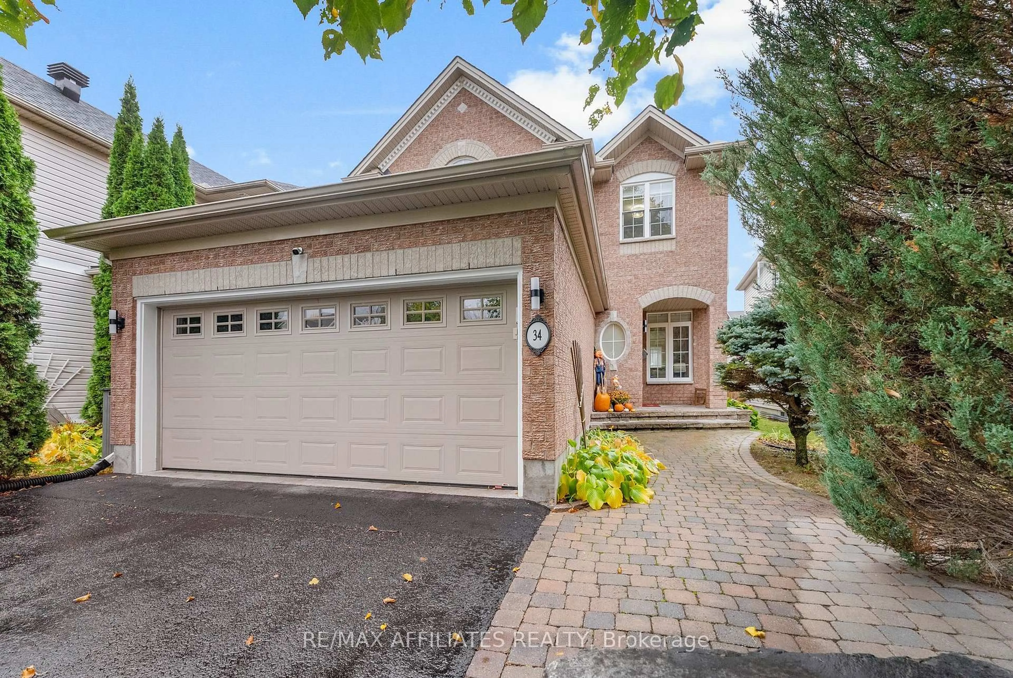 Home with brick exterior material, street for 34 Catterick Cres, Ottawa Ontario K2K 3M5