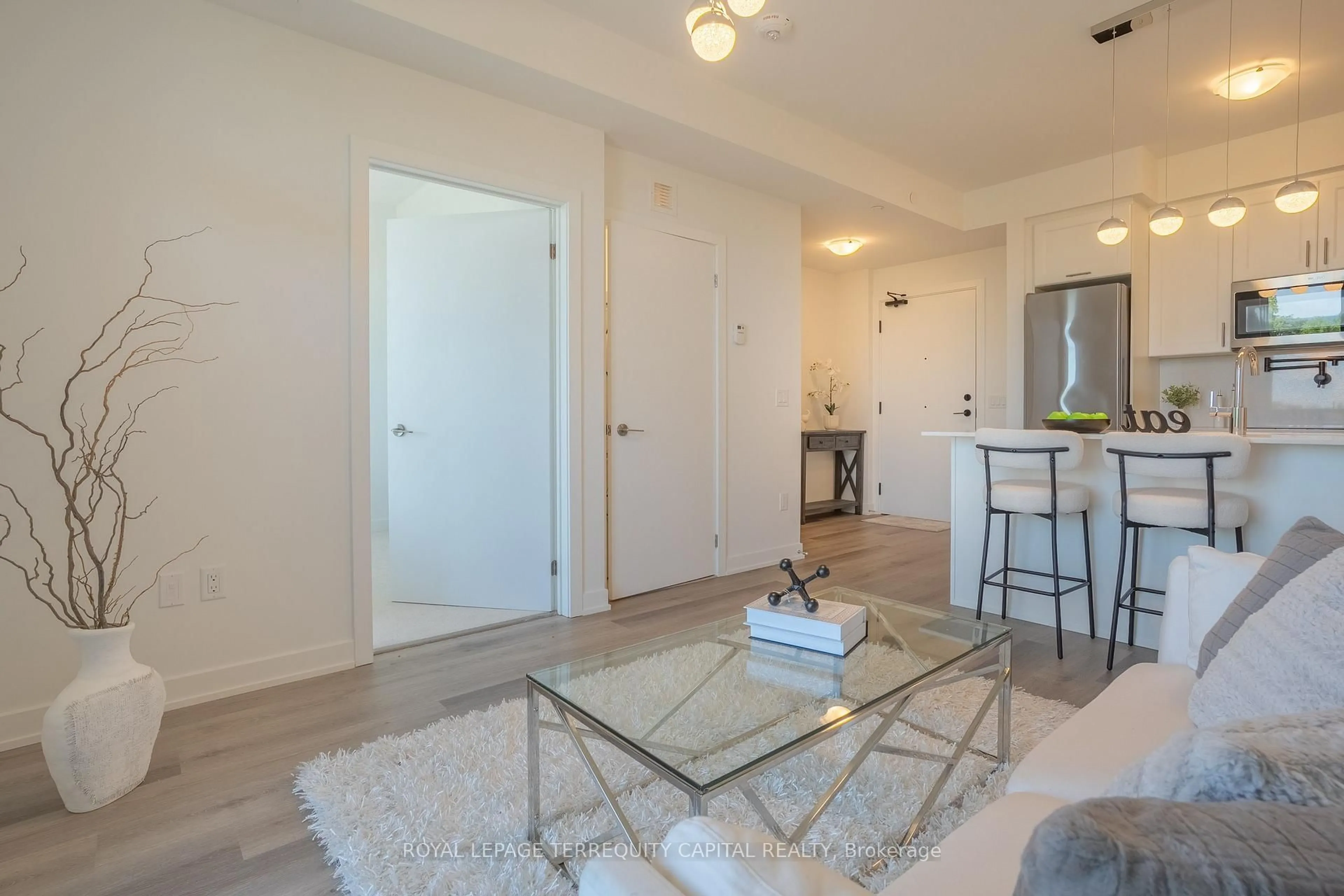 Living room with furniture, unknown for 600 North Service Rd #313, Hamilton Ontario L8E 0L2