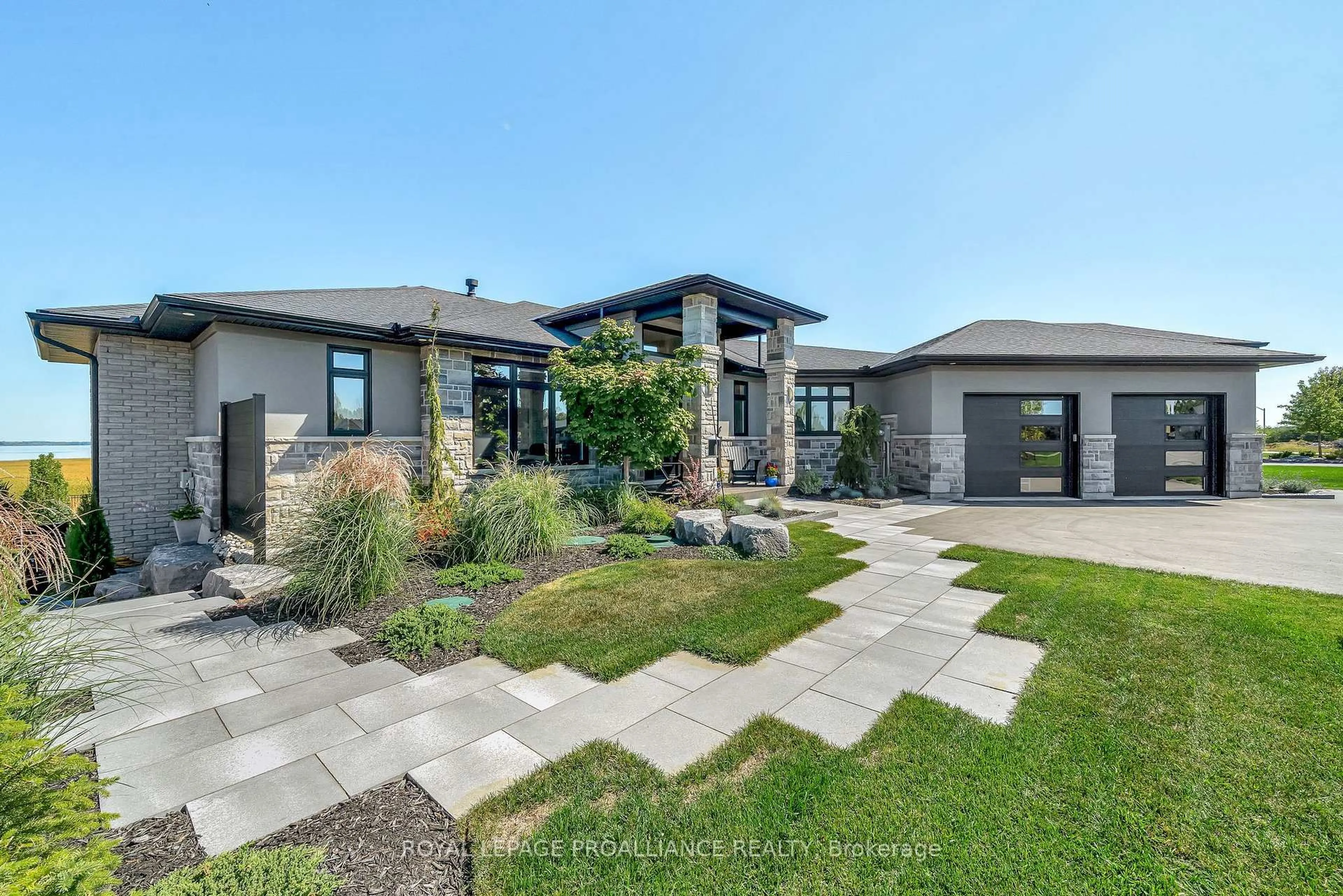 Home with brick exterior material, street for 77 Navigation Dr, Prince Edward County Ontario K8N 0G1