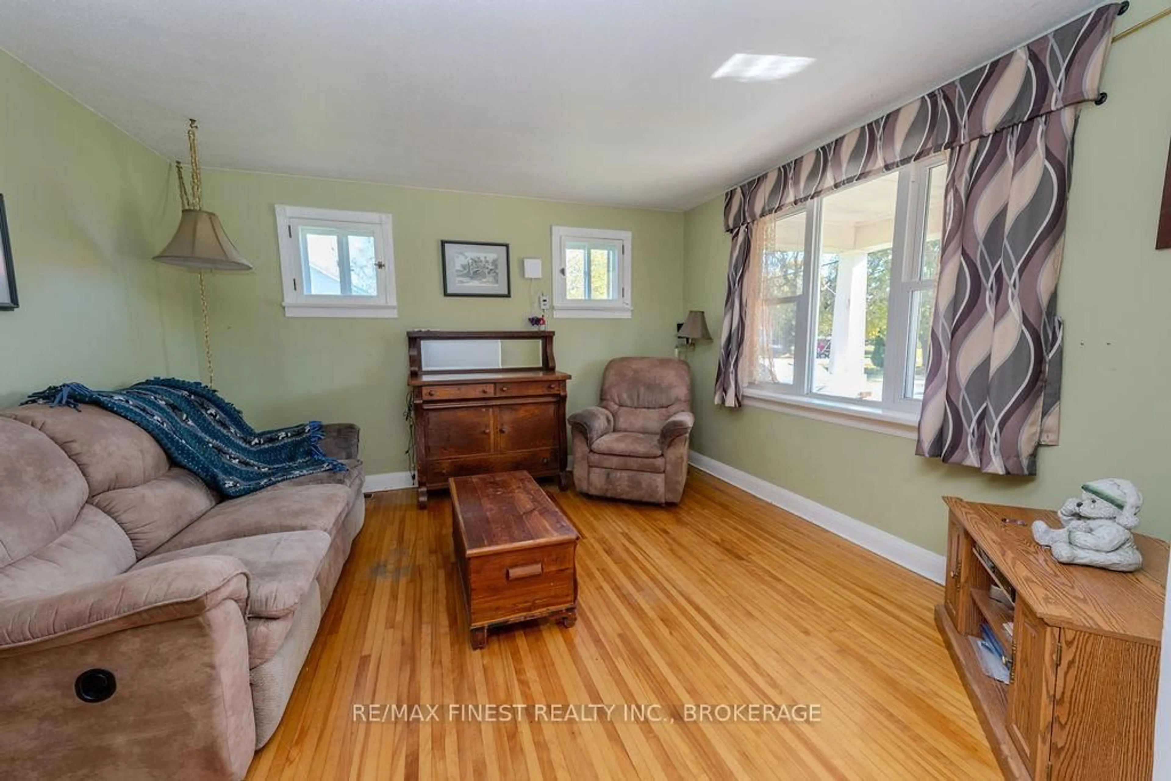 Living room with furniture, wood/laminate floor for 4737 Latimer Rd, Frontenac Ontario K0H 0A9