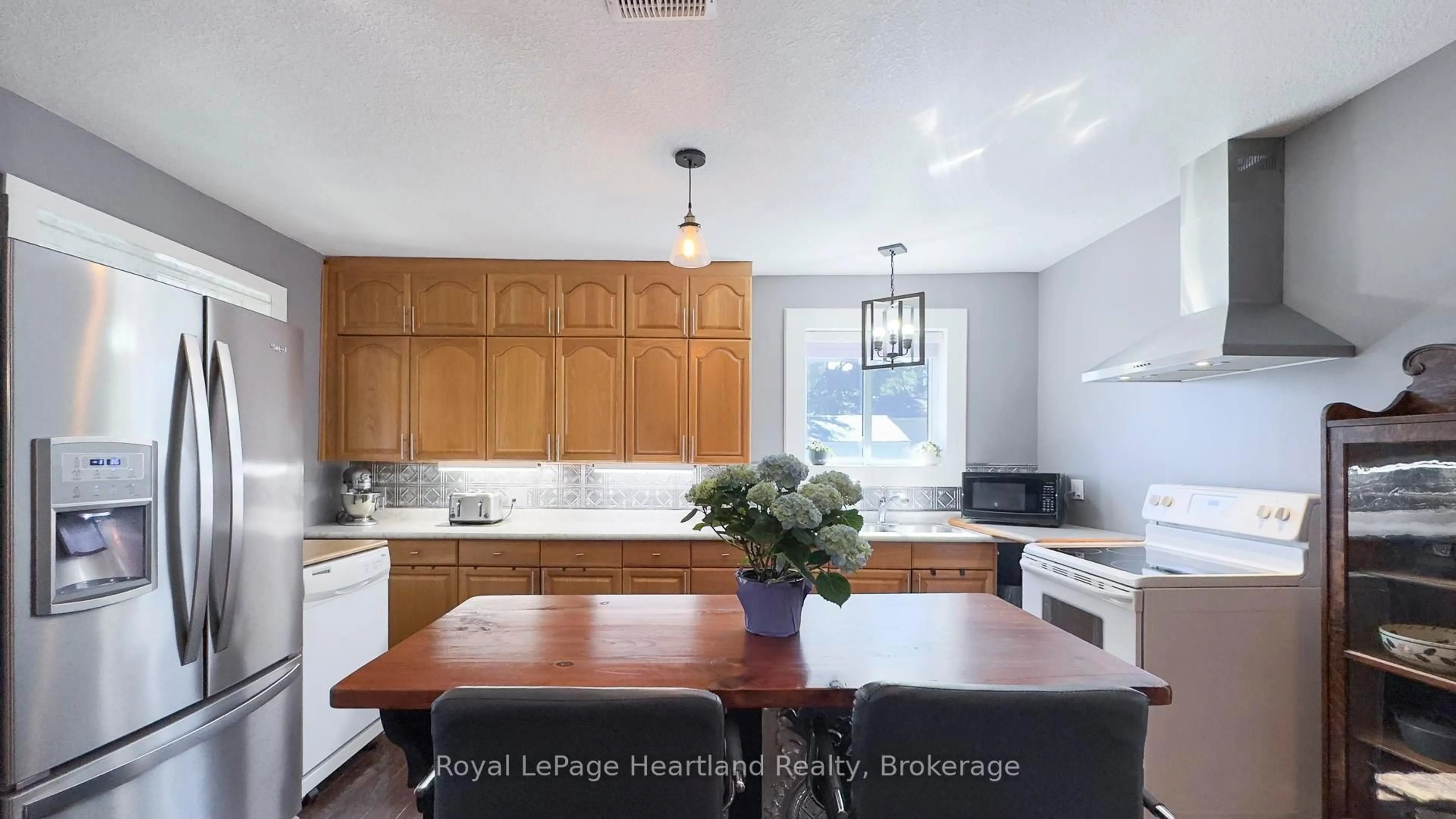 Open concept kitchen, wood/laminate floor for 36973 Londesboro Rd, Ashfield-Colborne-Wawanosh Ontario N7A 3Y1