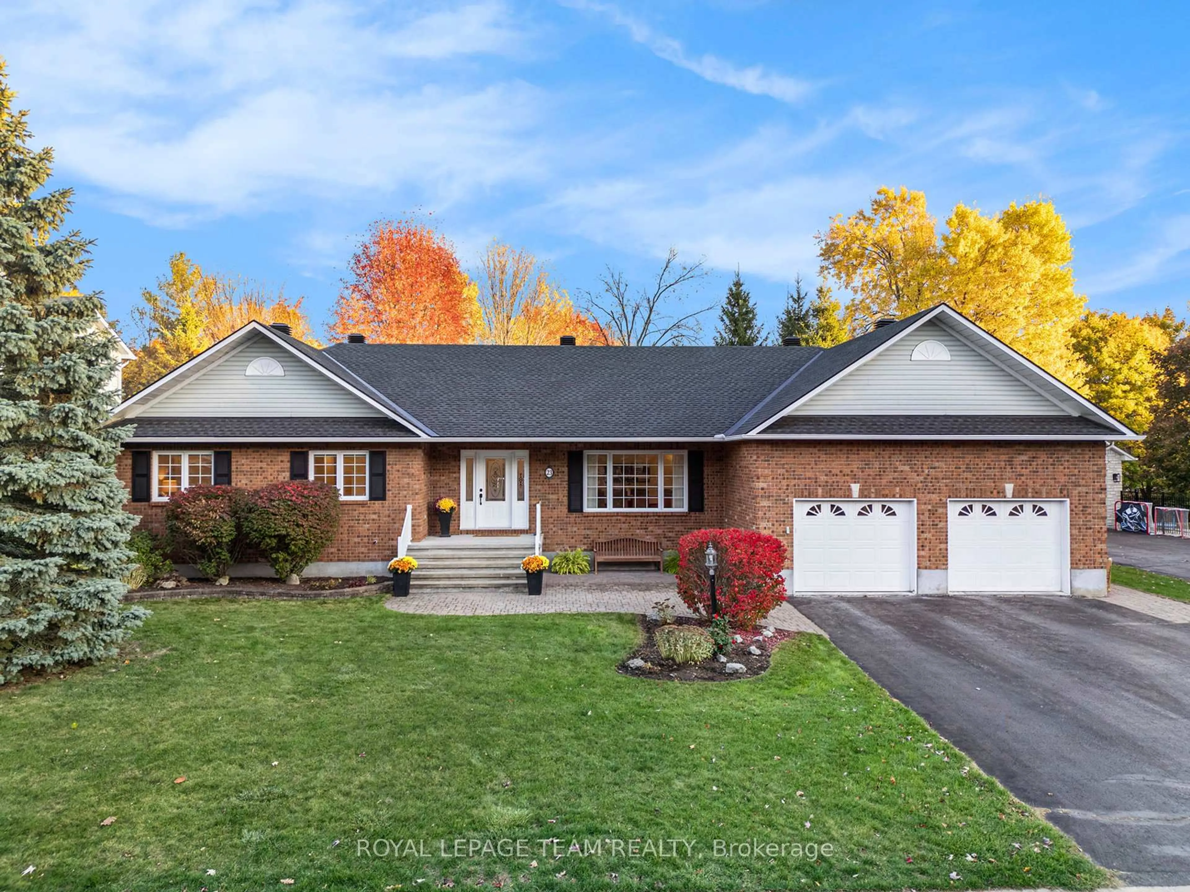 Home with brick exterior material, street for 23 Cypress Gdns, Stittsville Ontario K2S 1W6