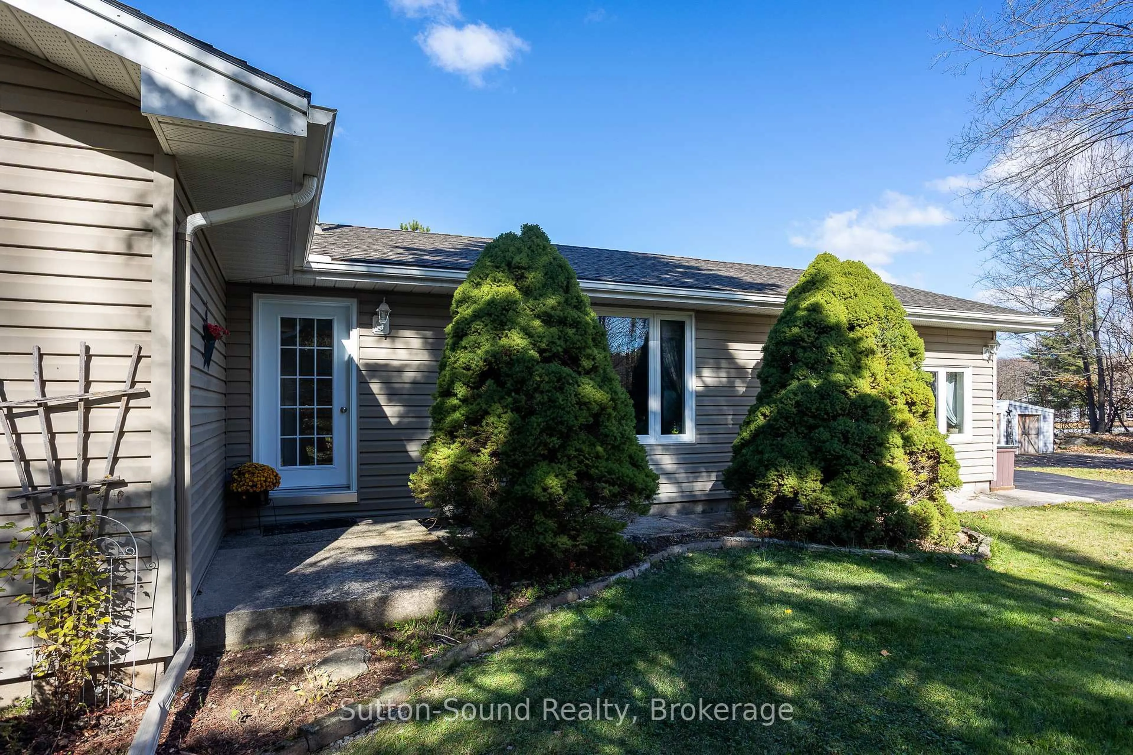 Home with vinyl exterior material, street for 143659 15 Sdrd, Meaford Ontario N4K 5W4