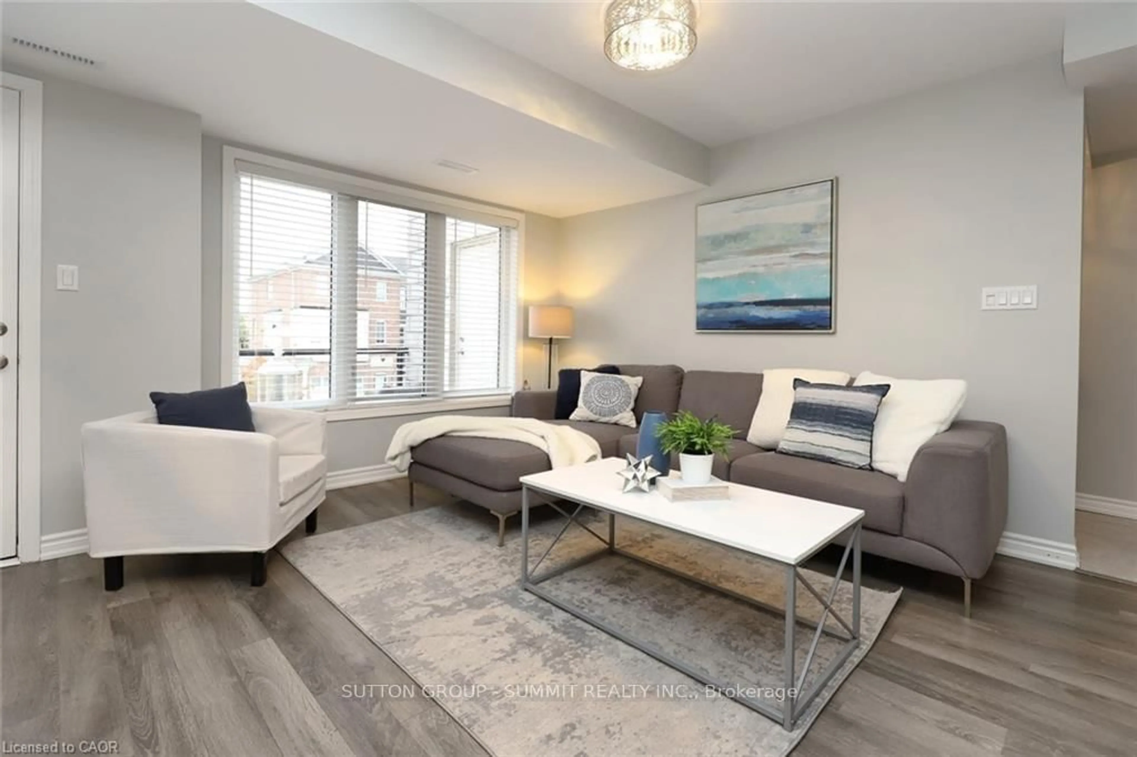 Living room with furniture, wood/laminate floor for 66 Daylily Lane, Kitchener Ontario N2R 0L7