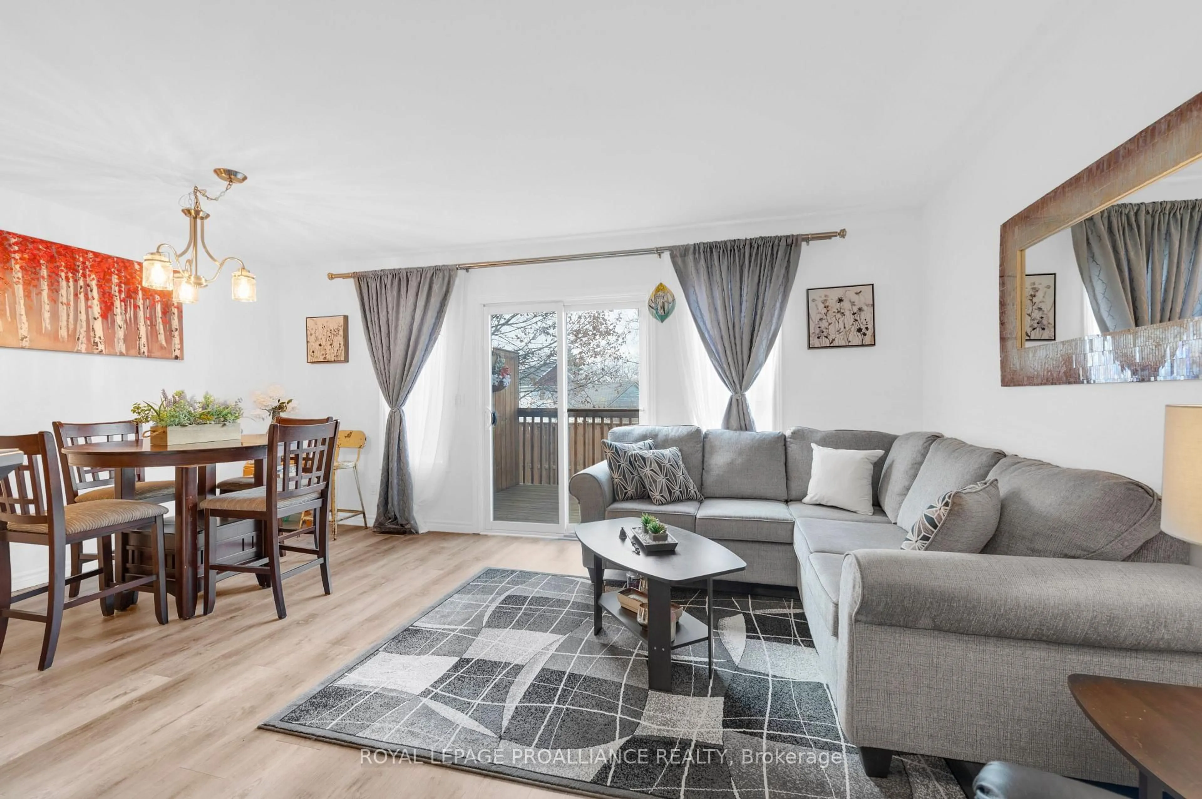 Living room with furniture, wood/laminate floor for 35 Albion St #37, Belleville Ontario K8N 5Y8