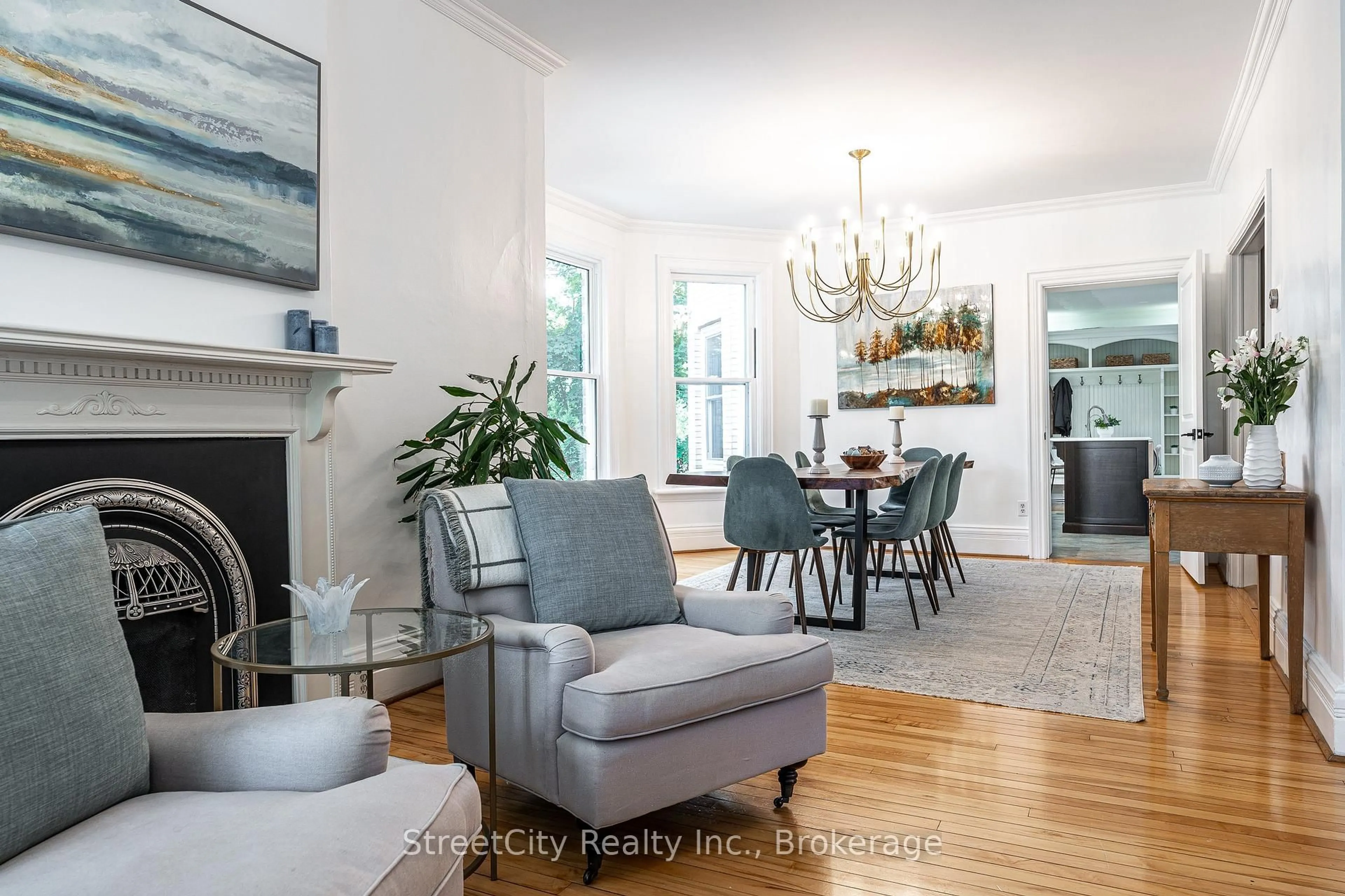 Living room with furniture, wood/laminate floor for 18 Waterloo St, Stratford Ontario N5A 5H5