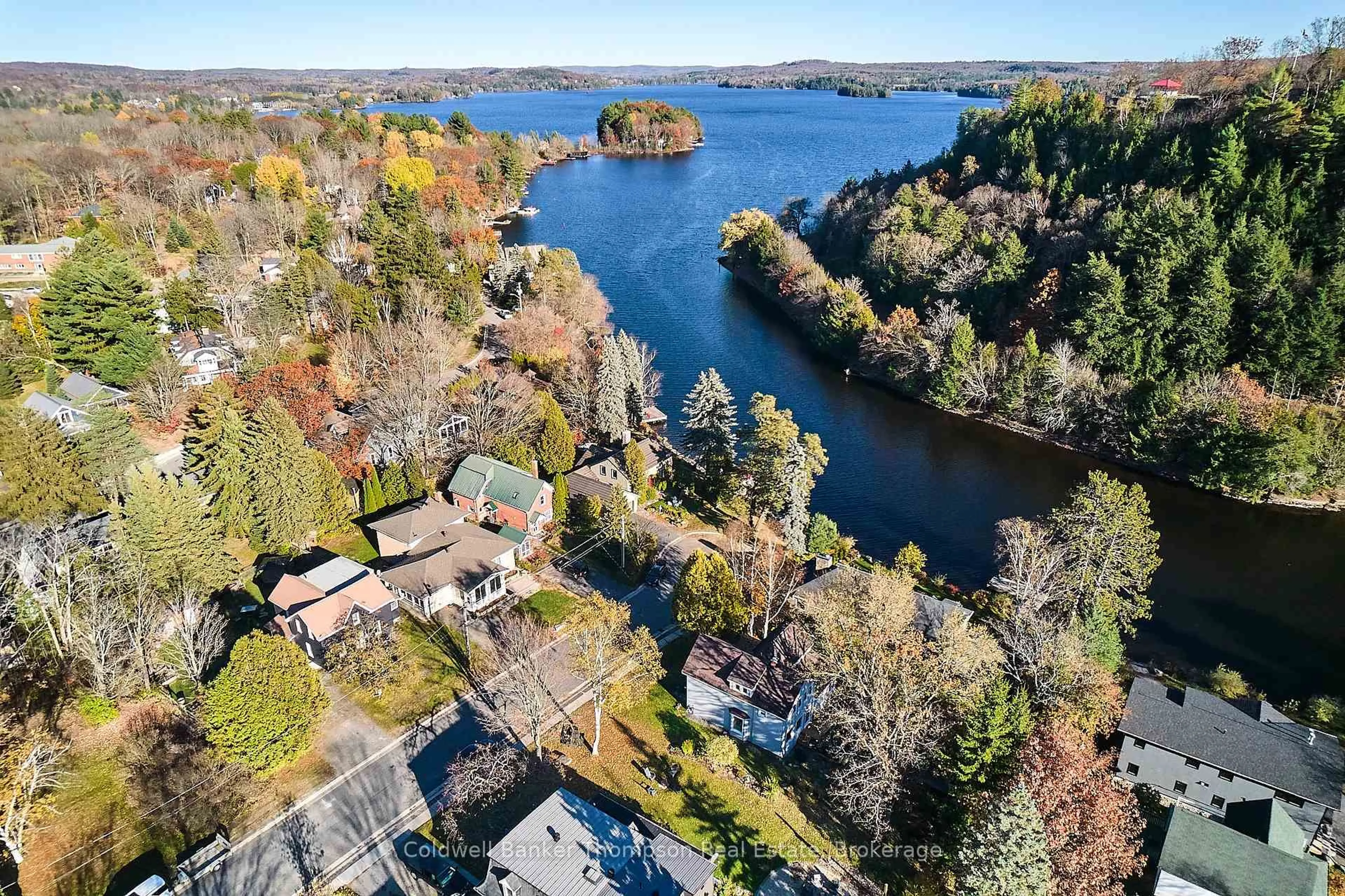 A pic from outside/outdoor area/front of a property/back of a property/a pic from drone, water/lake/river/ocean view for 23 Fairy Ave, Huntsville Ontario P1H 1G7