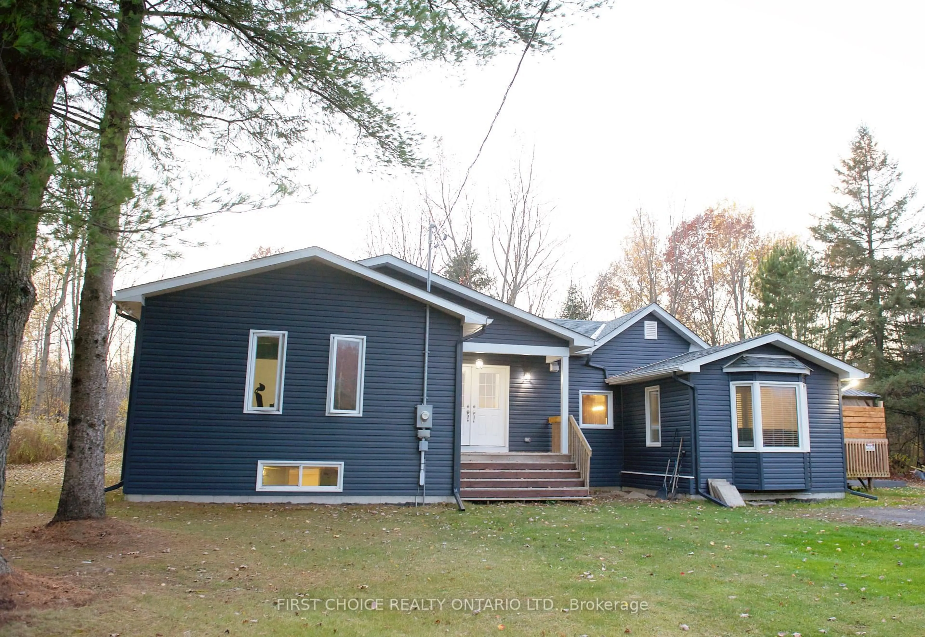 Home with vinyl exterior material, street for 1383 Baker Rd, The Nation Ontario K0A 1M0