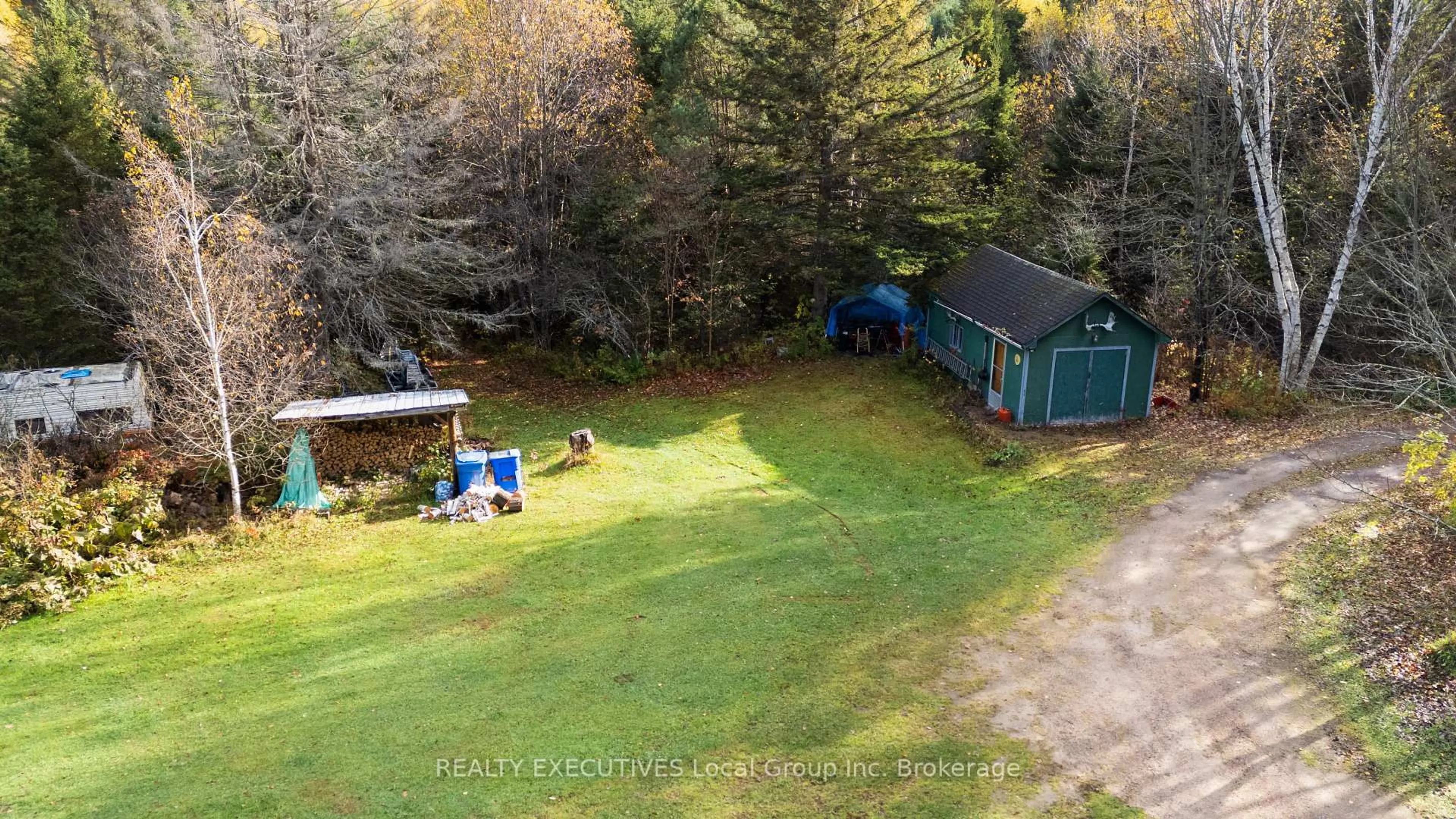 A pic from outside/outdoor area/front of a property/back of a property/a pic from drone, water/lake/river/ocean view for 3370 Chiswick Line, Chisholm Ontario P0H 1Z0