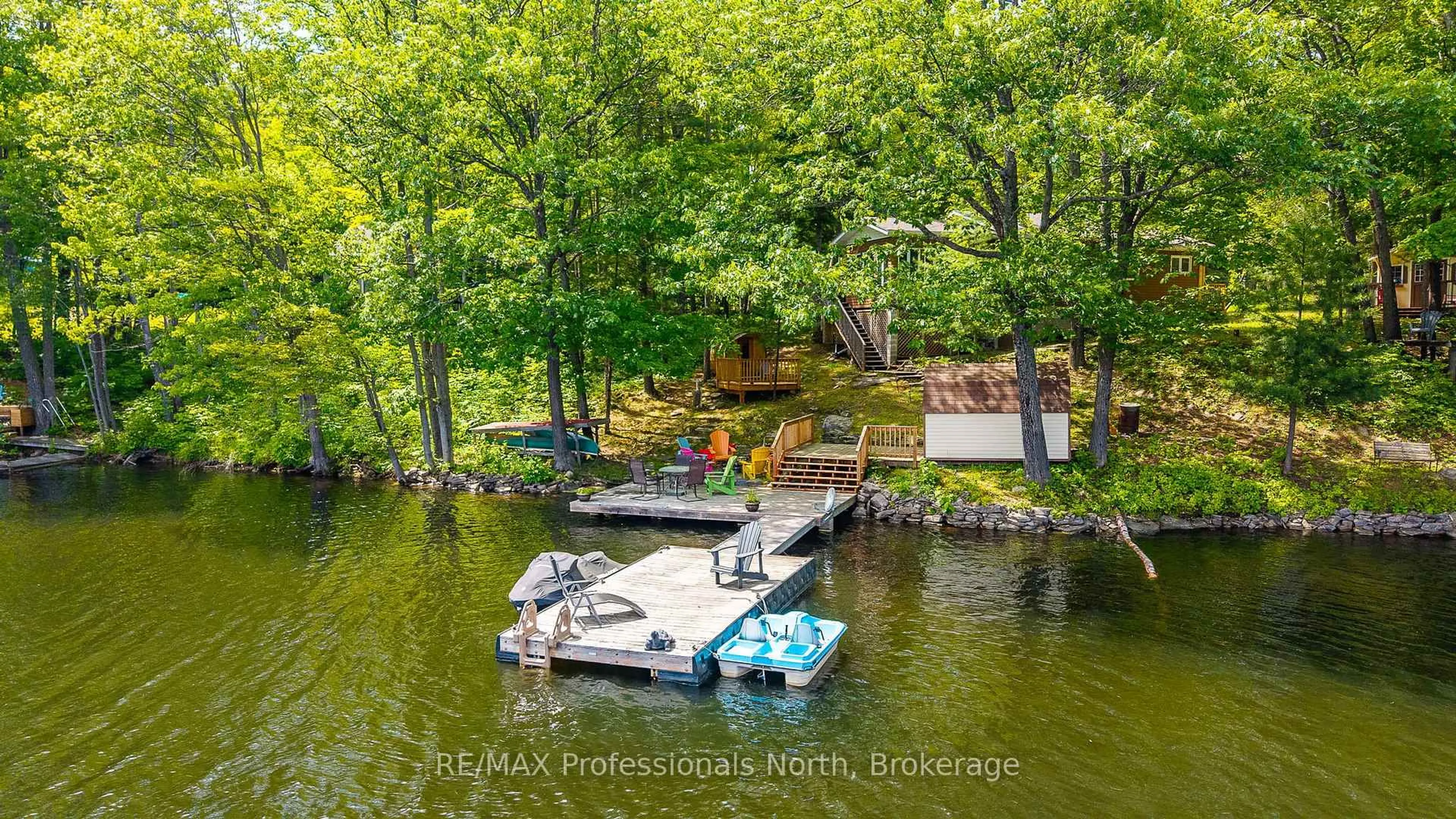 A pic from outside/outdoor area/front of a property/back of a property/a pic from drone, water/lake/river/ocean view for 1083 Jones Rd, Algonquin Highlands Ontario K0M 1J1