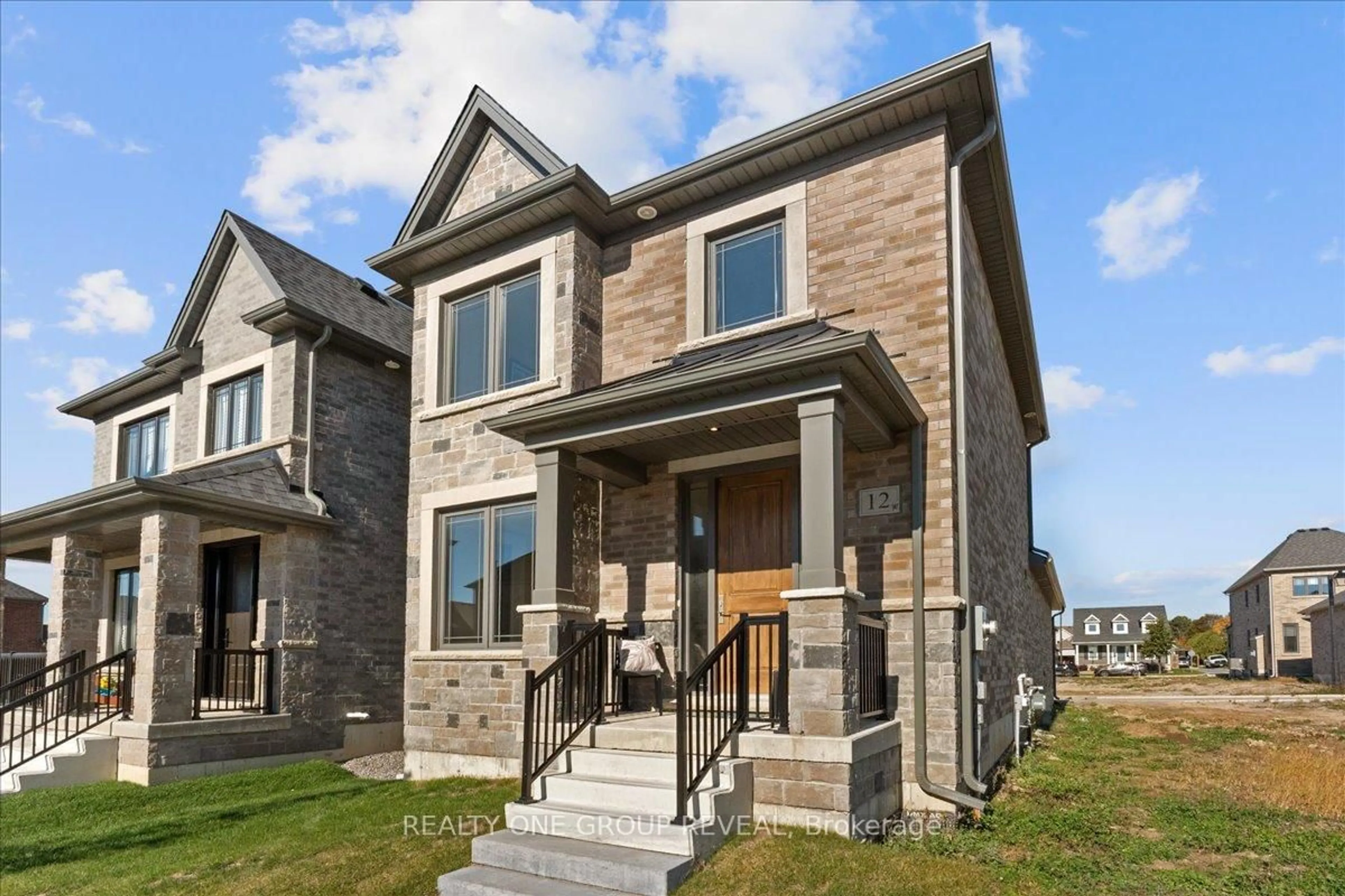 Home with brick exterior material, street for 12 Harrigan St, Port Hope Ontario L1A 0G6