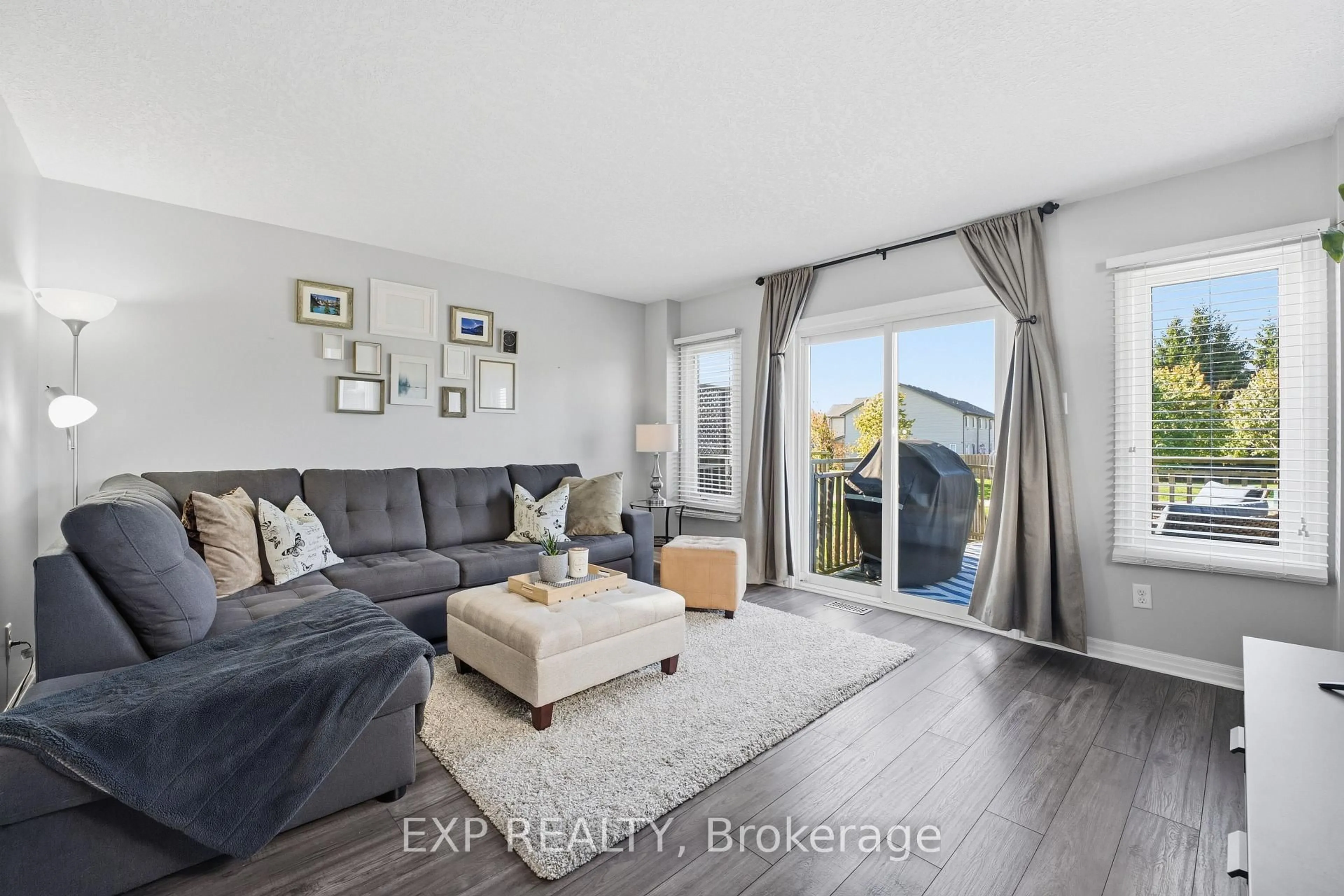 Living room with furniture, wood/laminate floor for 10 Foxglove Cres #6, Kitchener Ontario N2E 0E1