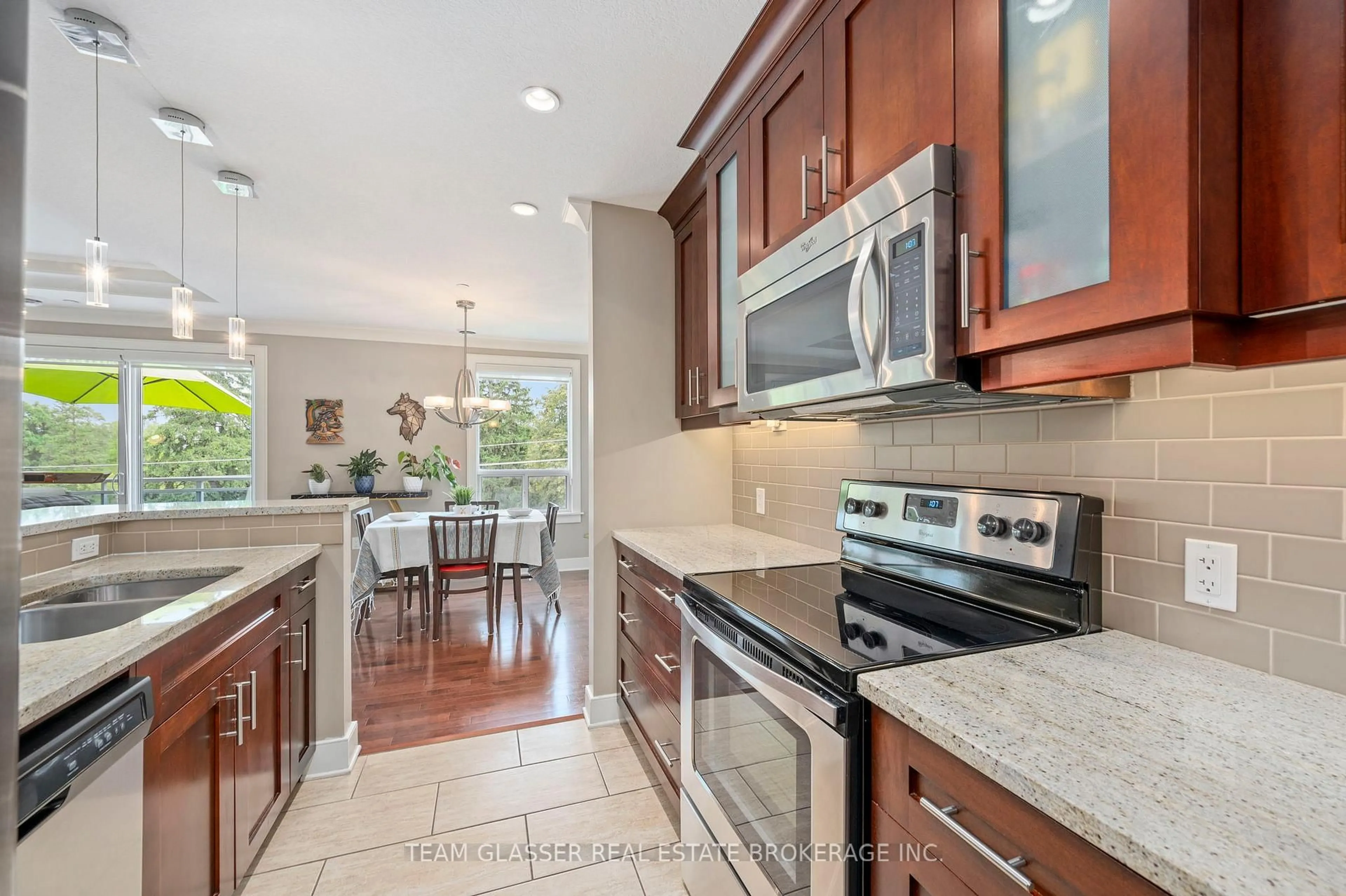 Open concept kitchen, ceramic/tile floor for 320 Sugarcreek Tr #414, London North Ontario N6H 0G3