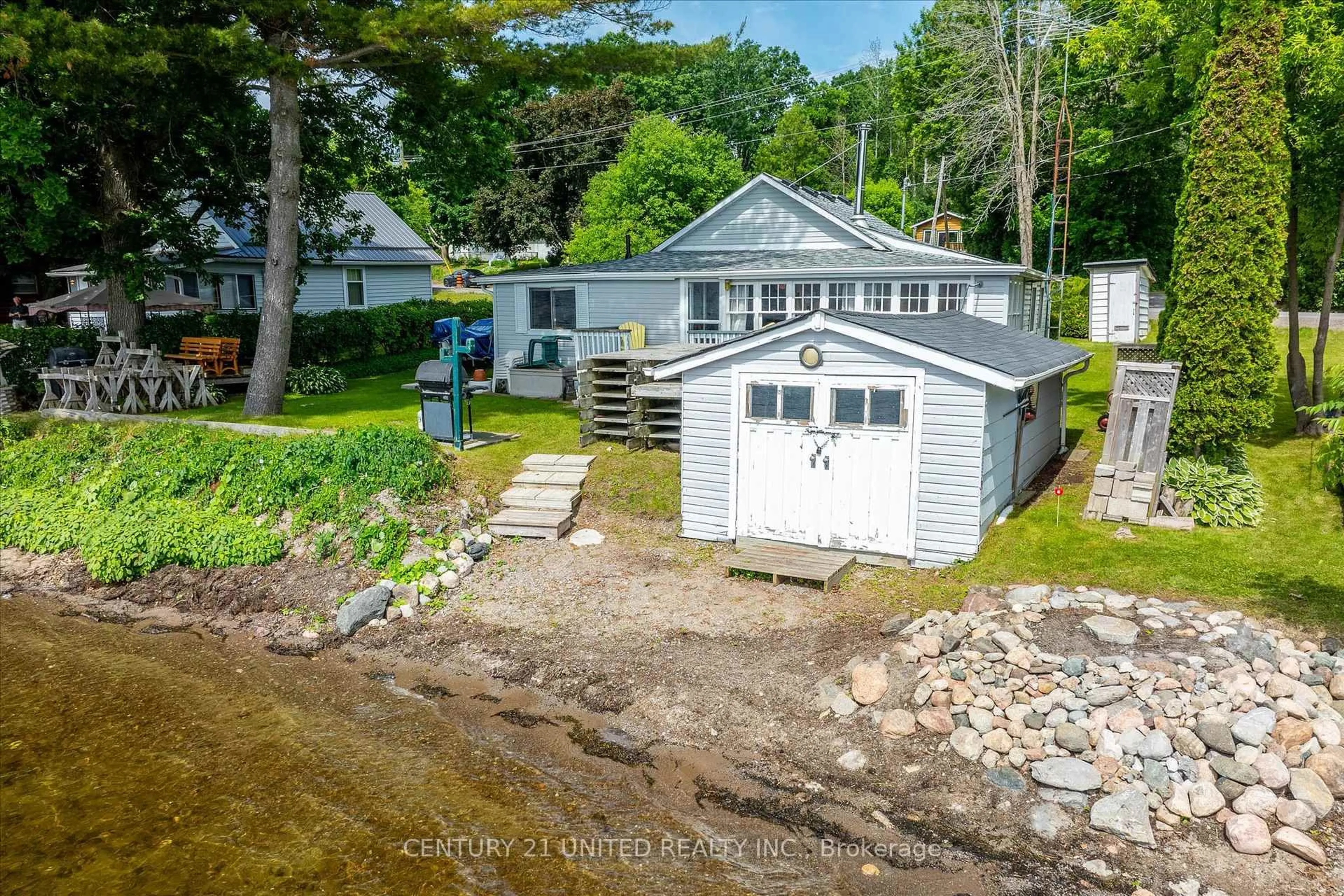 A pic from outside/outdoor area/front of a property/back of a property/a pic from drone, water/lake/river/ocean view for 221 Paudash St, Hiawatha First Nation Ontario K0L 2G0