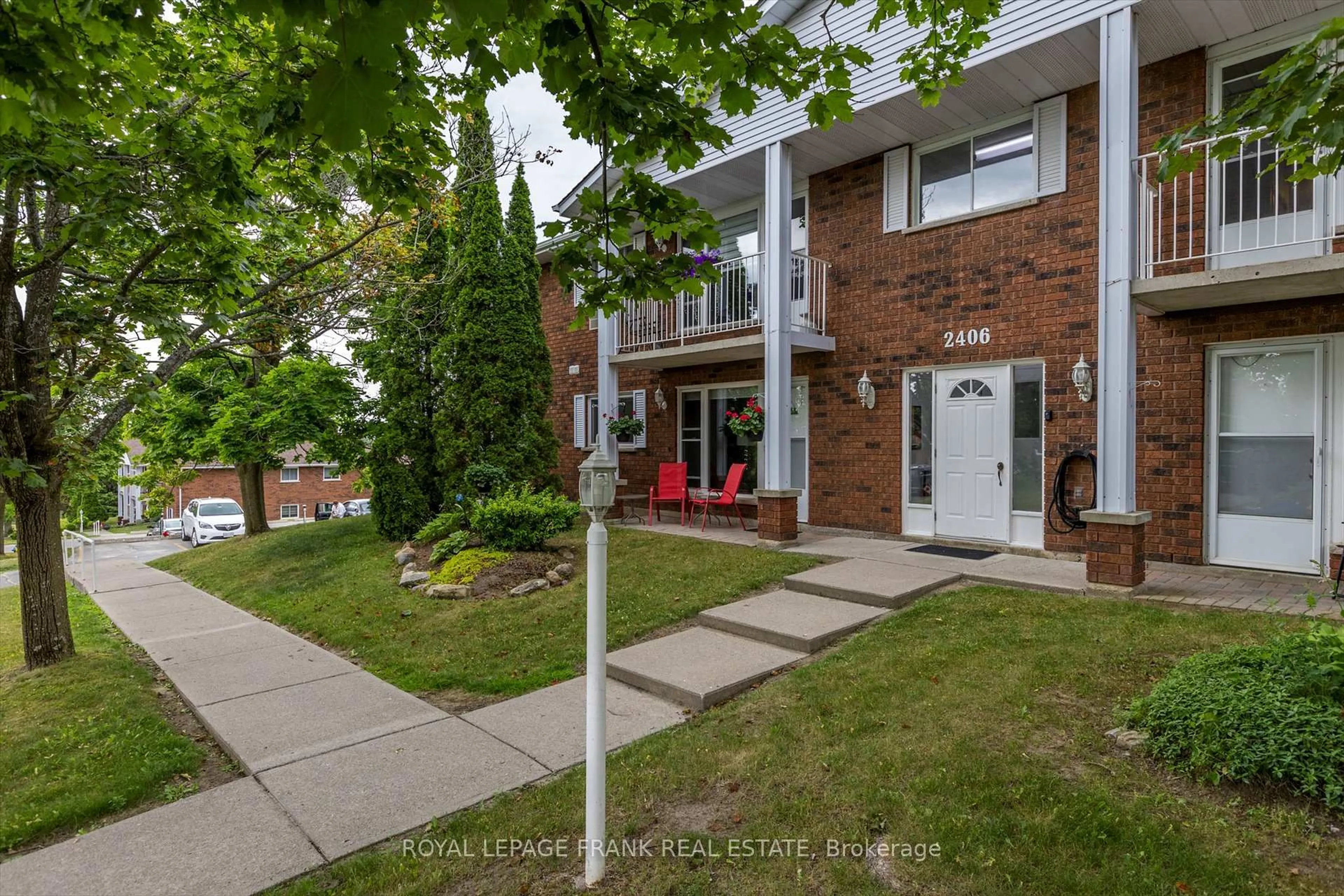 Home with brick exterior material, street for 2406 Mountland Dr #201, Peterborough West Ontario K9K 2E1