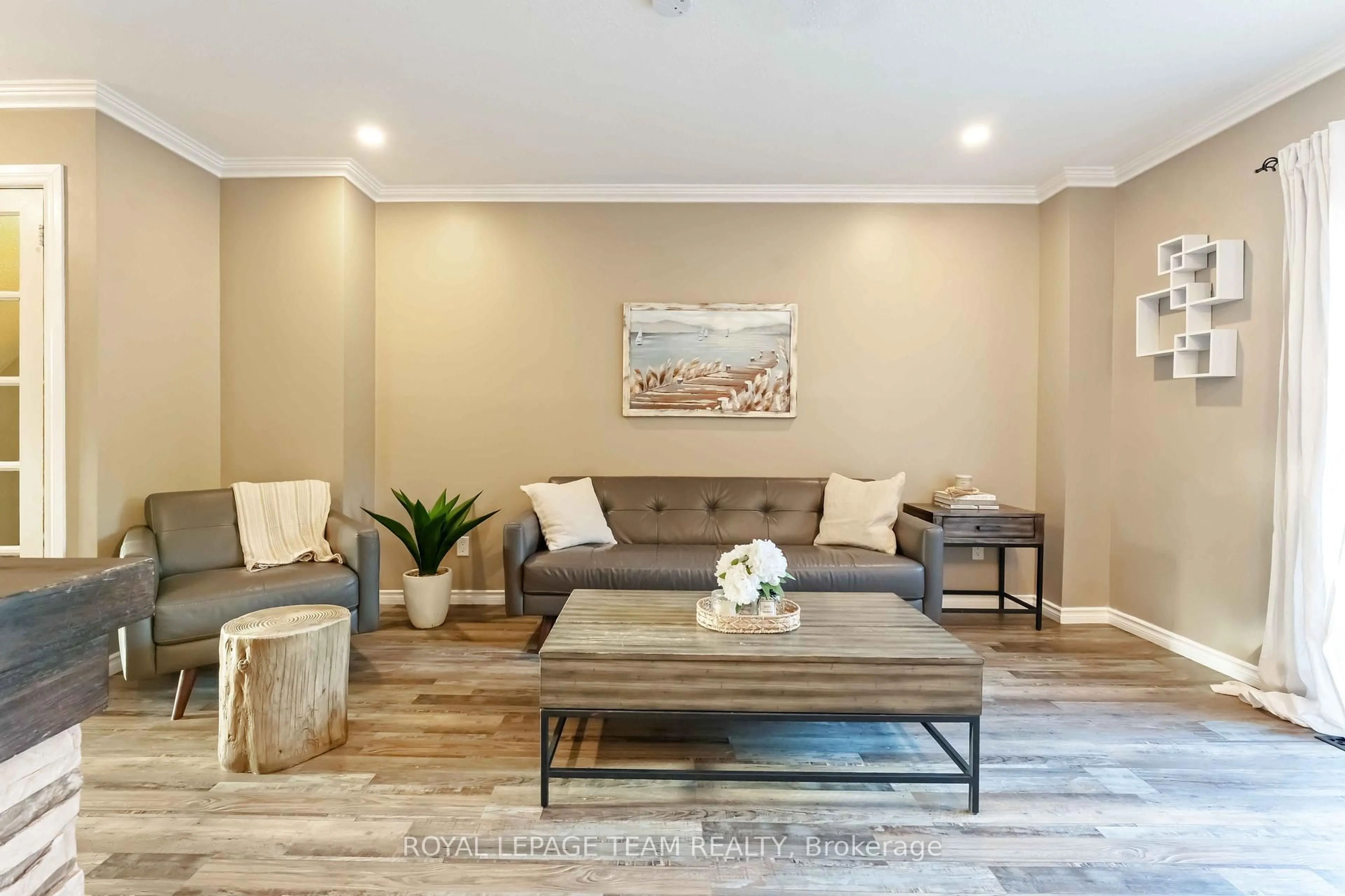 Living room with furniture, wood/laminate floor for 3 Fulham Crt, Ottawa Ontario K2J 2L6