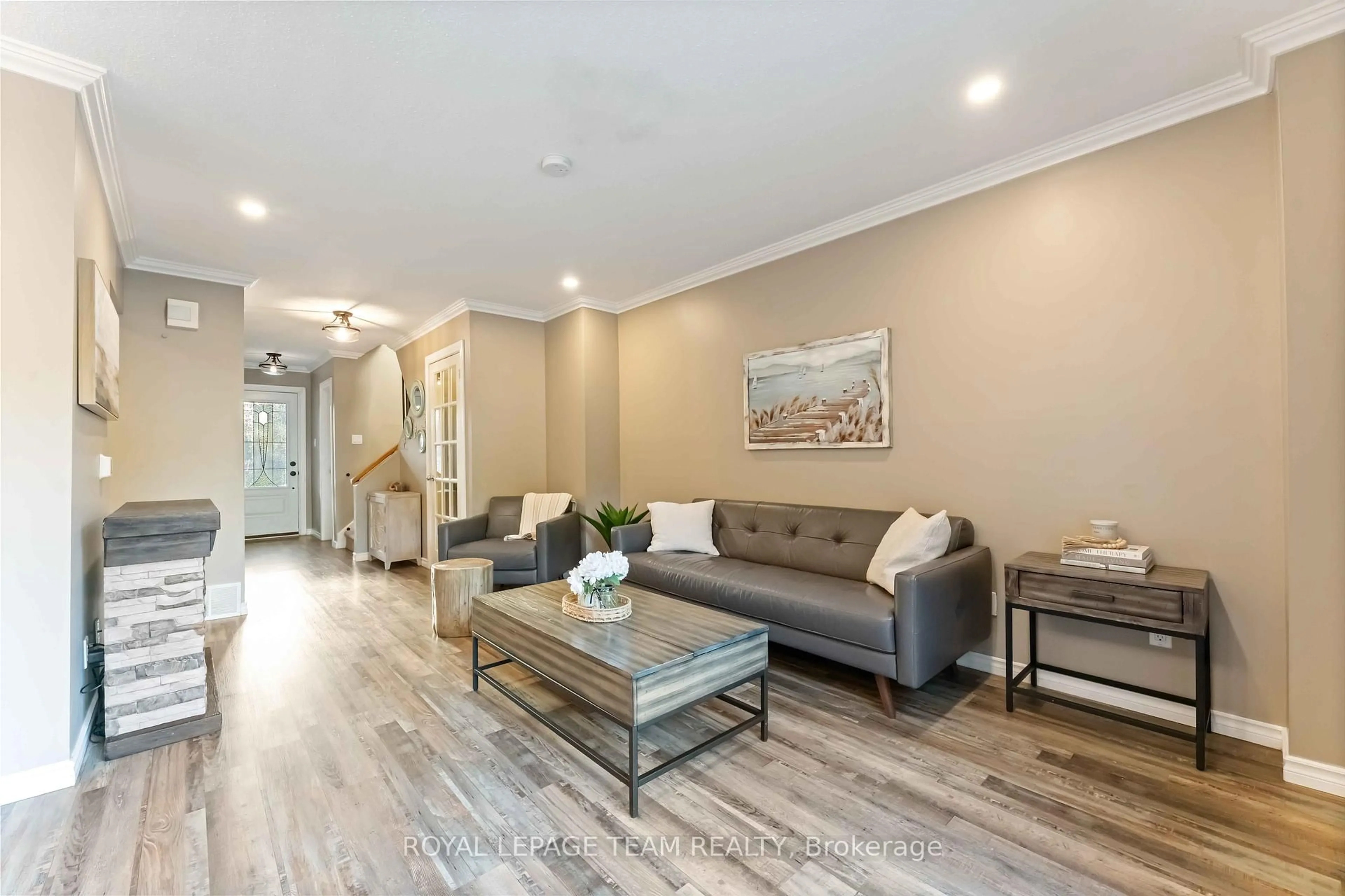 Living room with furniture, wood/laminate floor for 3 Fulham Crt, Ottawa Ontario K2J 2L6