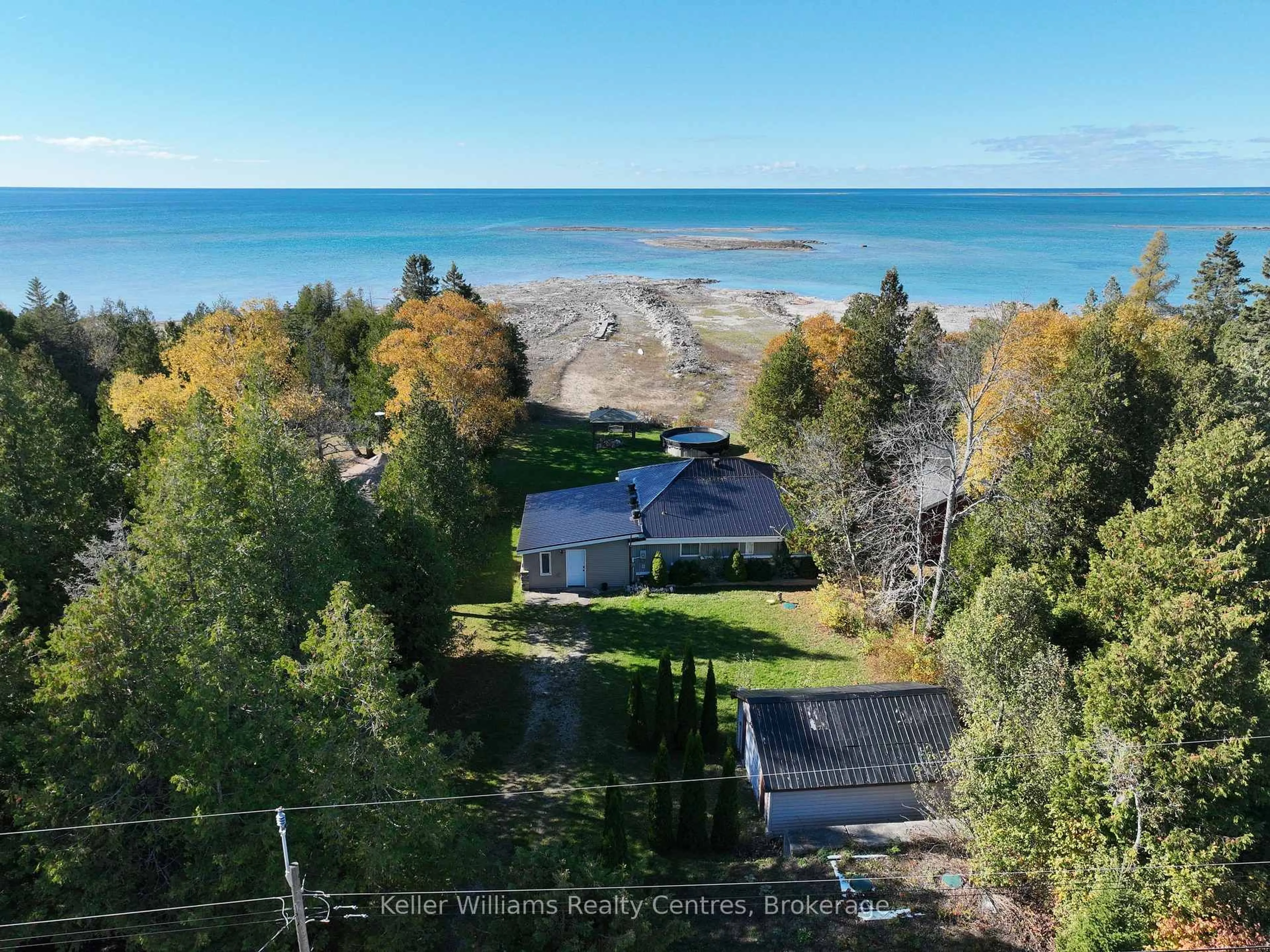 A pic from outside/outdoor area/front of a property/back of a property/a pic from drone, water/lake/river/ocean view for 1256 SUNSET DRIVE, South Bruce Peninsula Ontario N0H 2T0