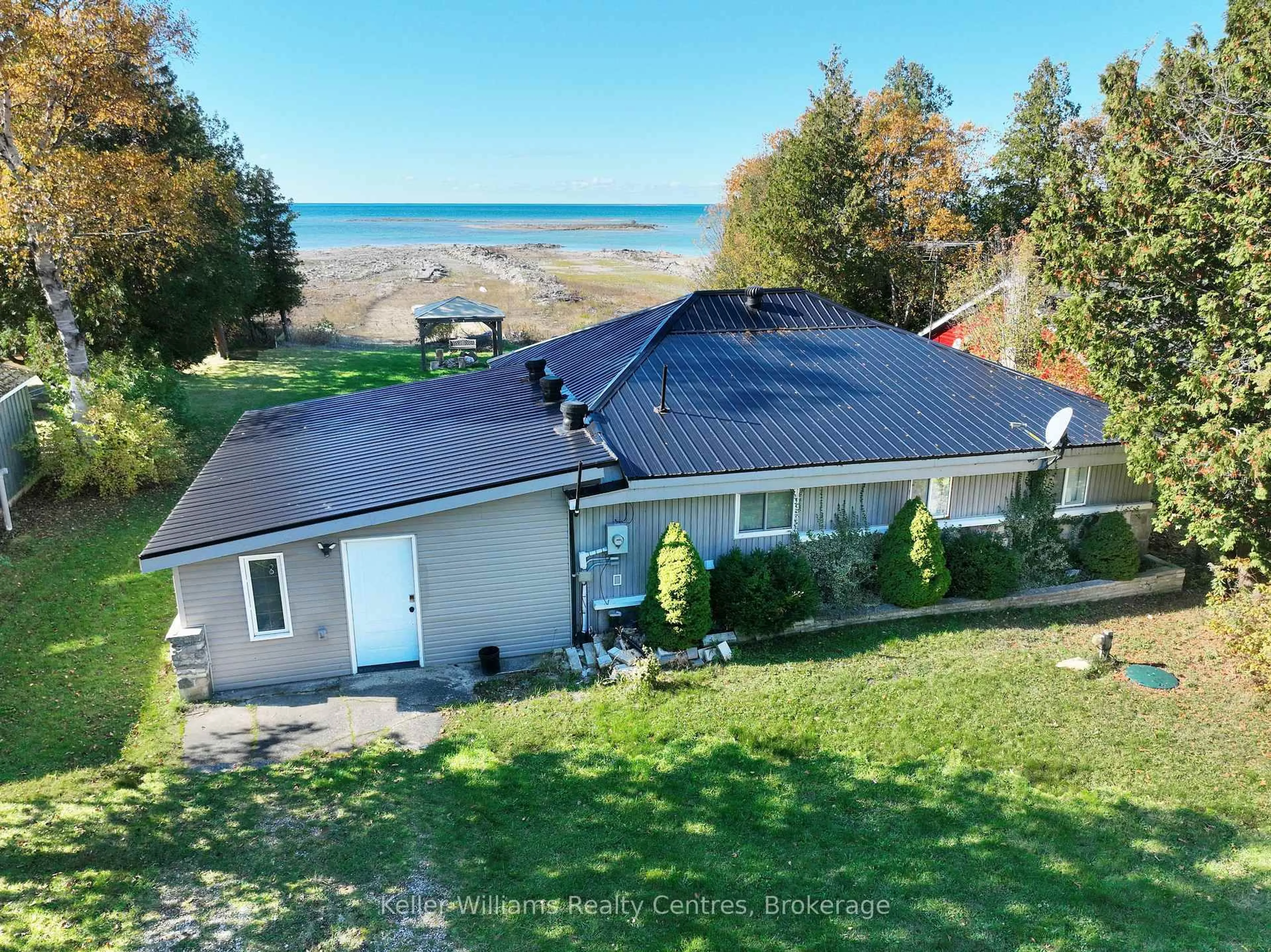 A pic from outside/outdoor area/front of a property/back of a property/a pic from drone, water/lake/river/ocean view for 1256 SUNSET DRIVE, South Bruce Peninsula Ontario N0H 2T0