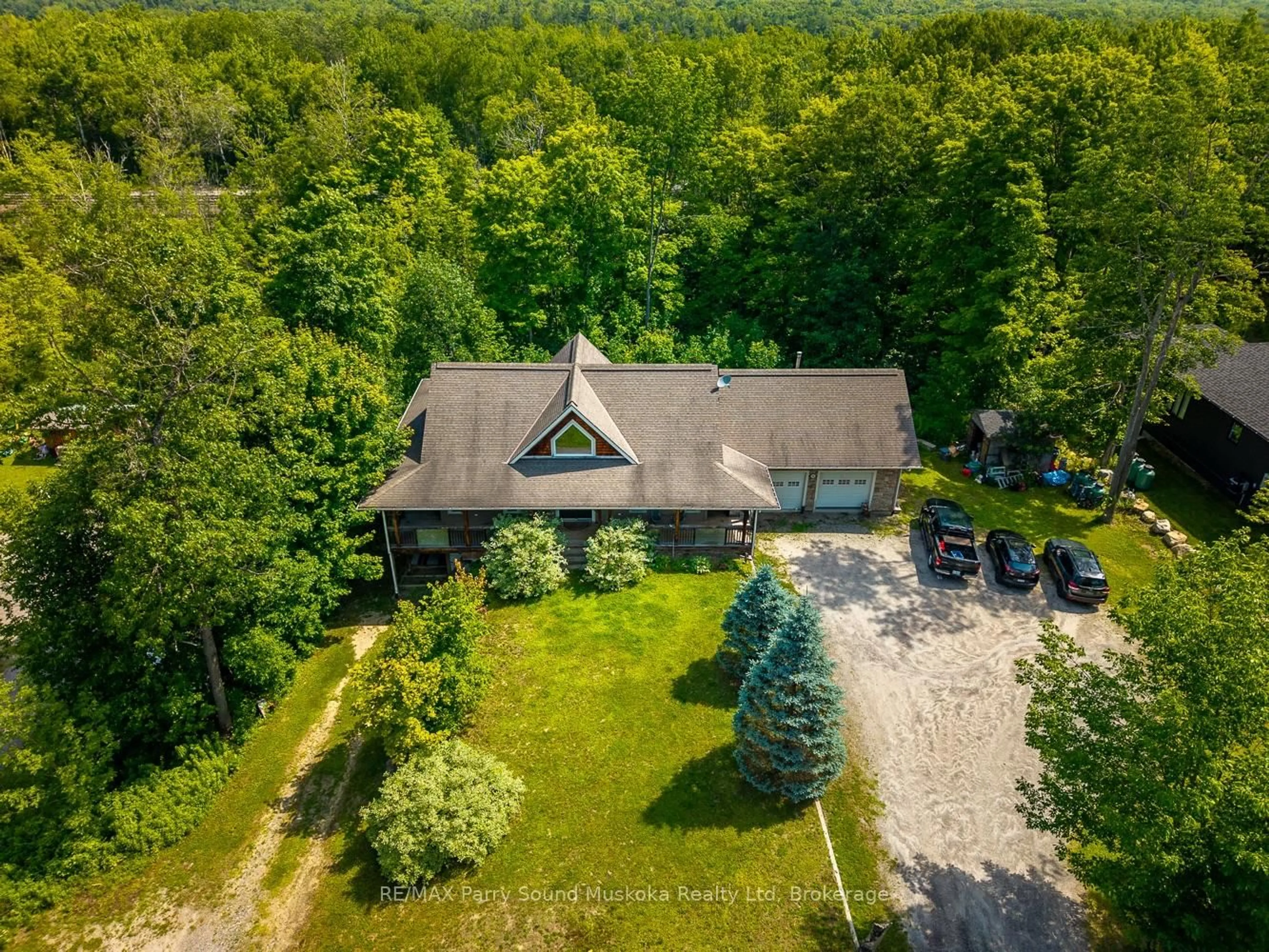 A pic from outside/outdoor area/front of a property/back of a property/a pic from drone, forest/trees view for 246 High St, Georgian Bay Ontario P0C 1H0