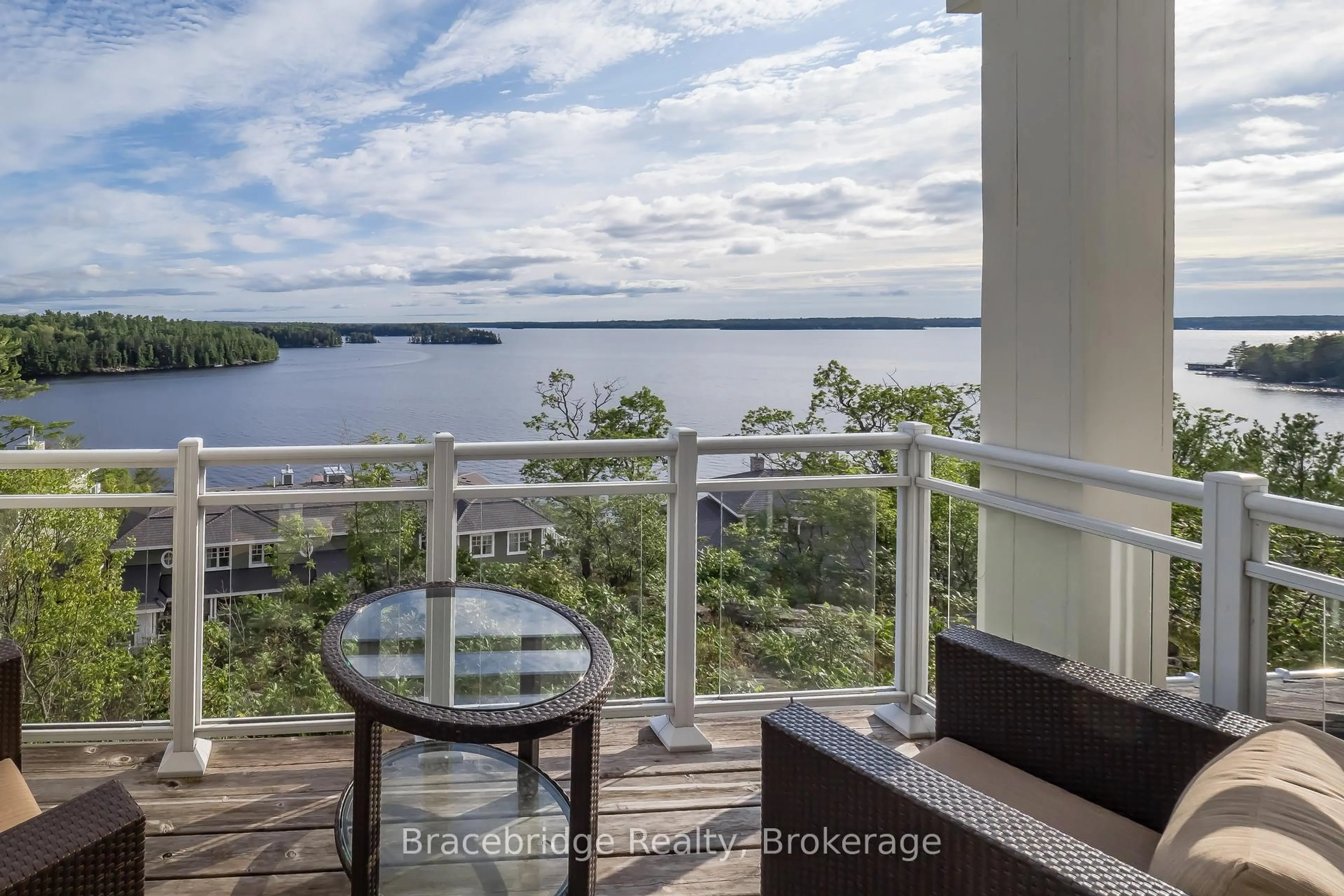 Balcony in the apartment, water/lake/river/ocean view for 1869 Muskoka Rd 118 W Highway, Muskoka Lakes Ontario P1L 1W9