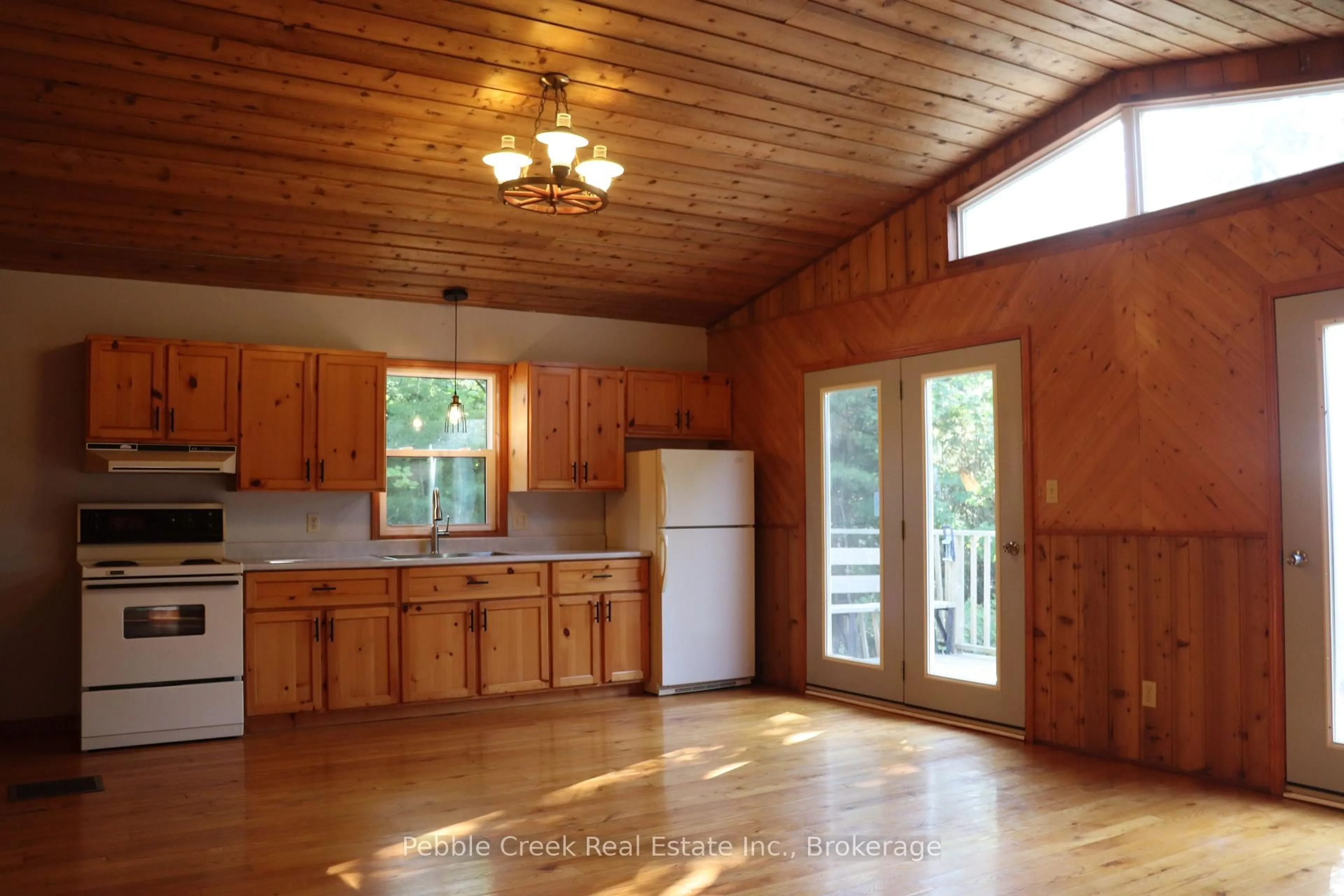 Open concept kitchen, wood/laminate floor for 84433 Sunrise Dr, Ashfield-Colborne-Wawanosh Ontario N7A 3X9