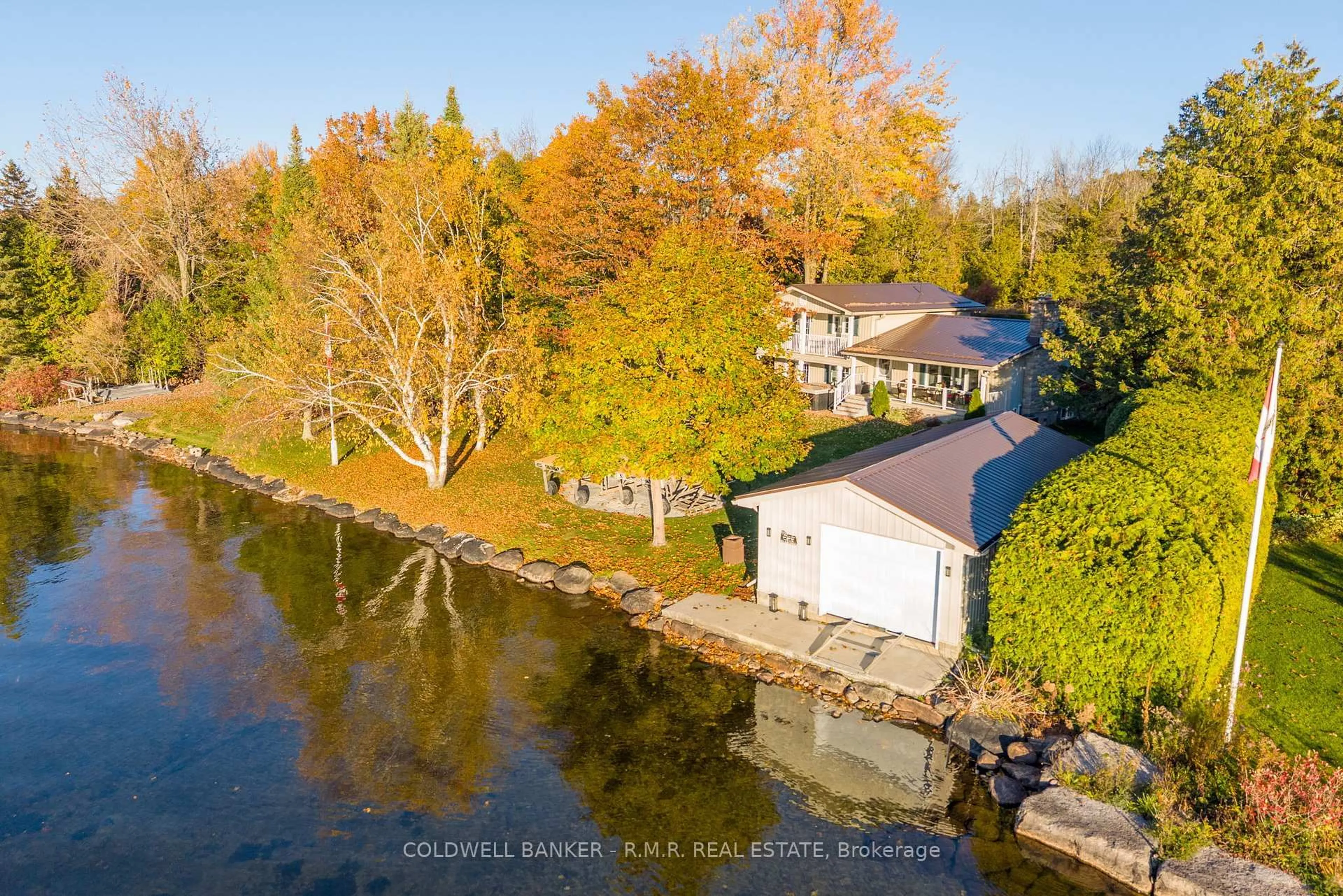 A pic from outside/outdoor area/front of a property/back of a property/a pic from drone, water/lake/river/ocean view for 32 Iris Dr, Kawartha Lakes Ontario K0M 1G0