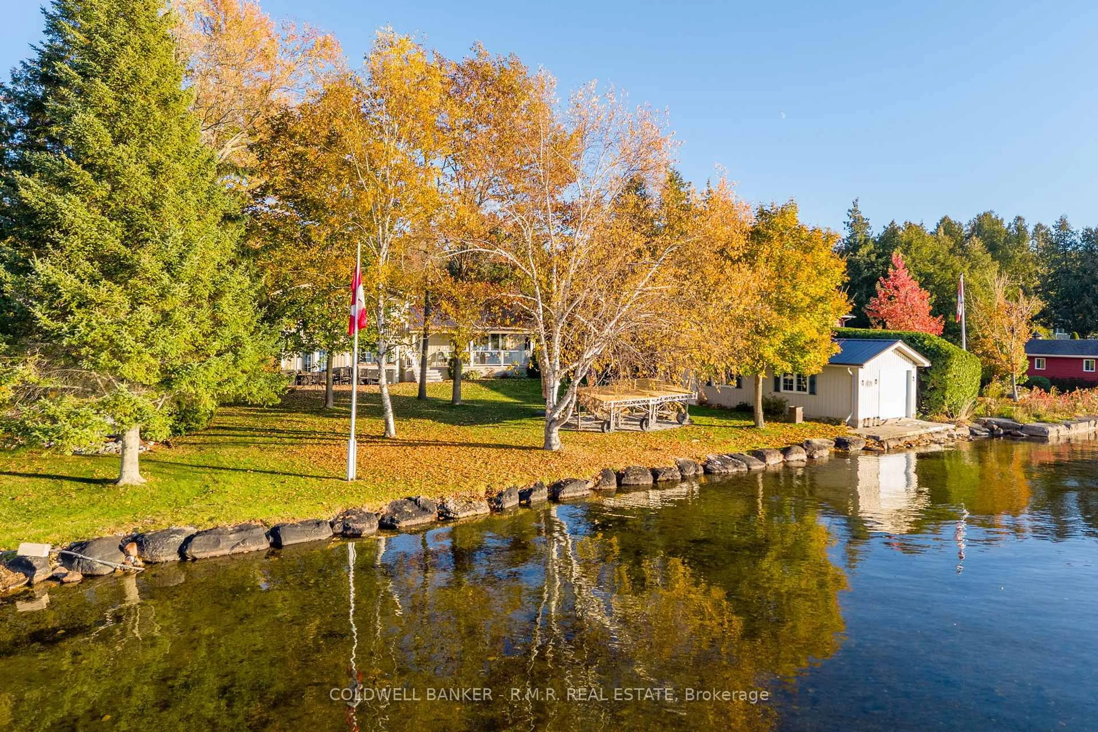 A pic from outside/outdoor area/front of a property/back of a property/a pic from drone, water/lake/river/ocean view for 32 Iris Dr, Kawartha Lakes Ontario K0M 1G0