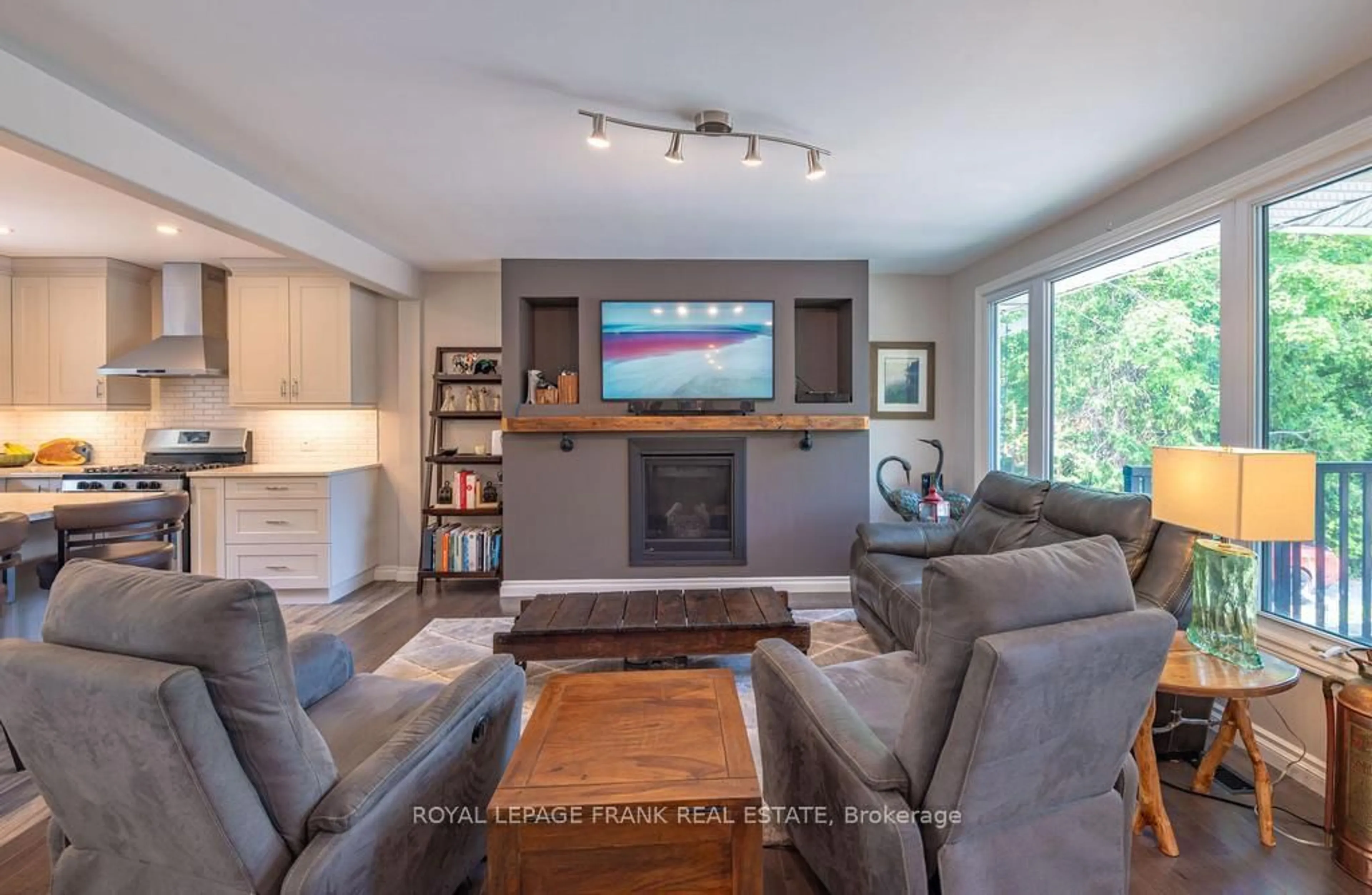 Living room with furniture, wood/laminate floor for 1746 Lakehurst Rd, Trent Lakes Ontario K0L 1J0