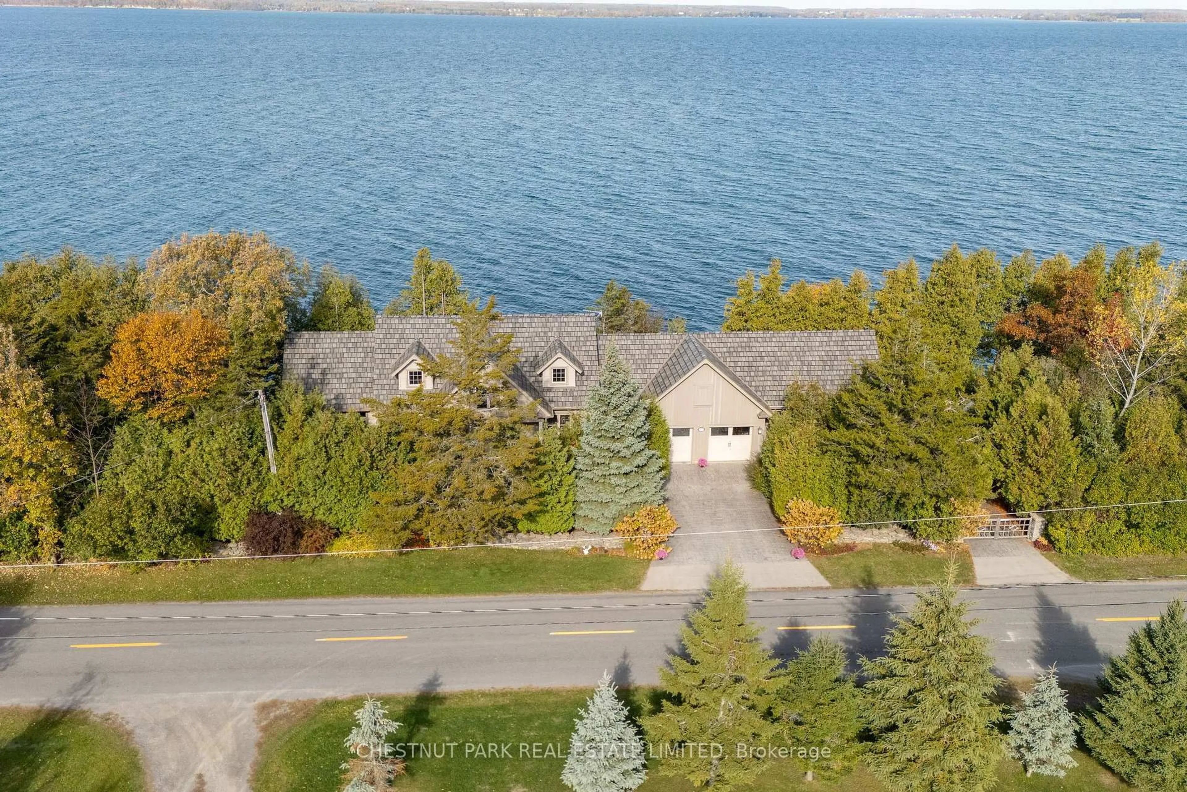 A pic from outside/outdoor area/front of a property/back of a property/a pic from drone, water/lake/river/ocean view for 3853 County Road 13, Prince Edward County Ontario K0K 2T0