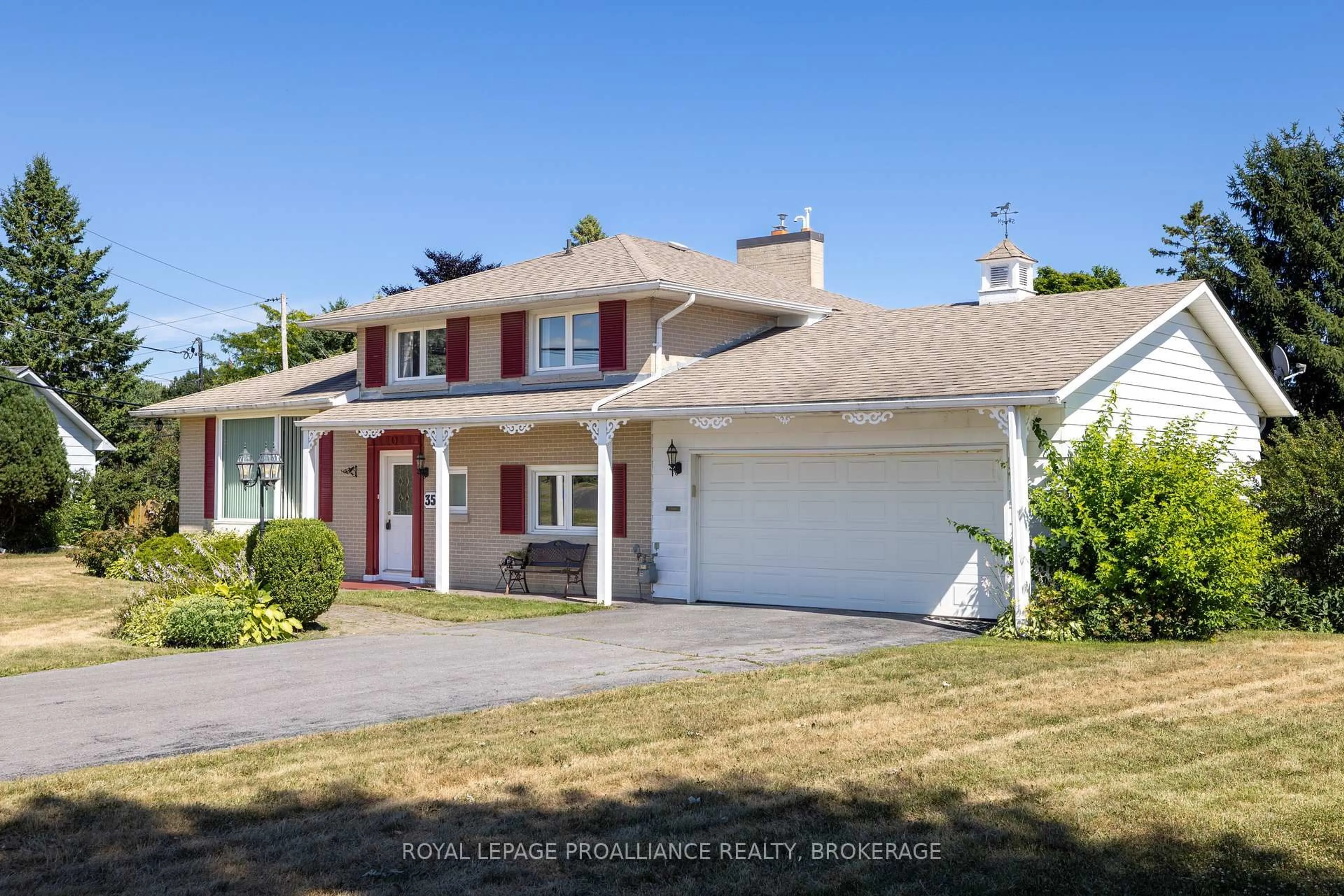 Home with vinyl exterior material, street for 35 Manitou Cres, Loyalist Ontario K7N 1B1