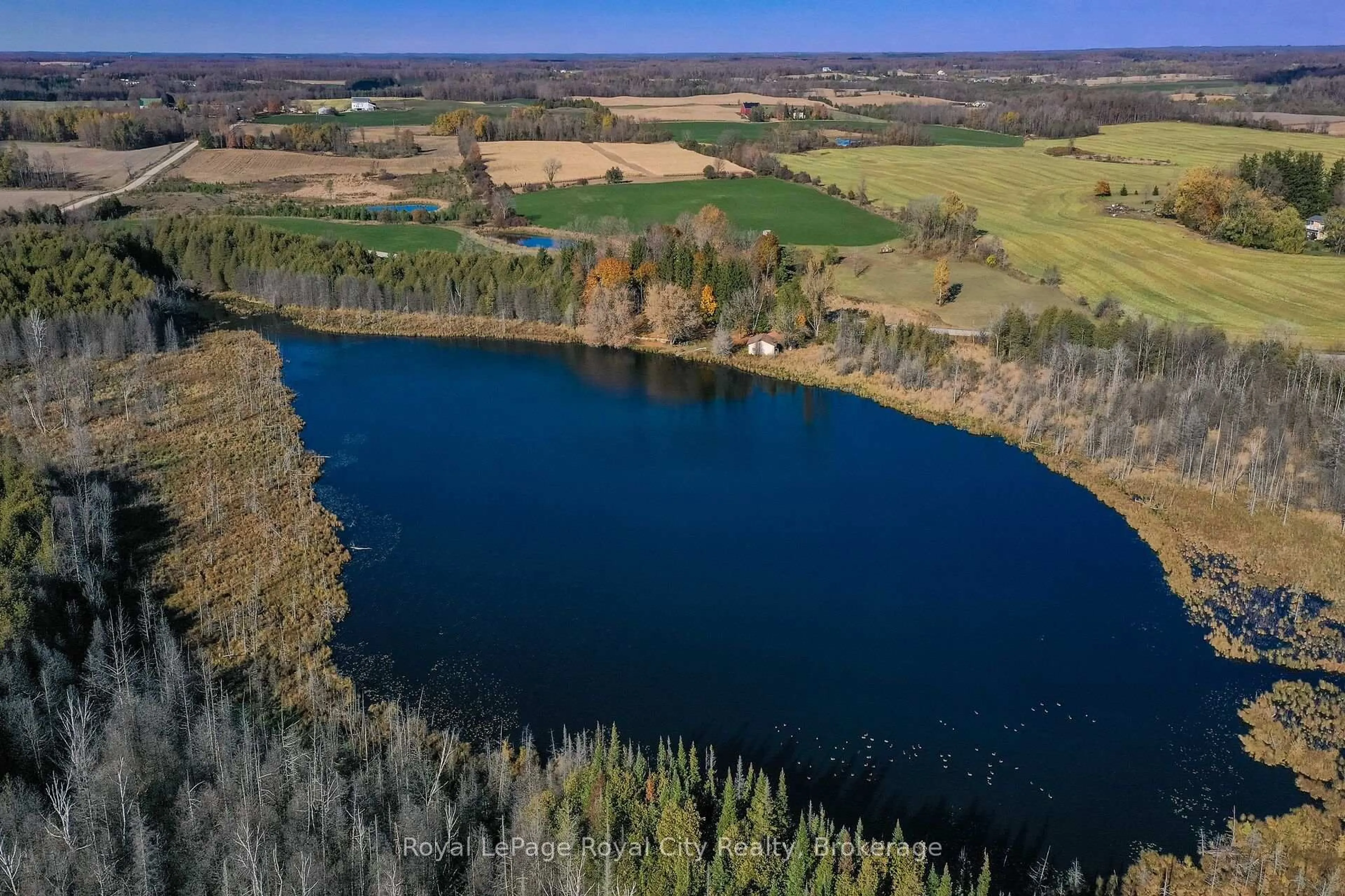 A pic from outside/outdoor area/front of a property/back of a property/a pic from drone, water/lake/river/ocean view for 6361 16th Line, Minto Ontario N0G 1M0