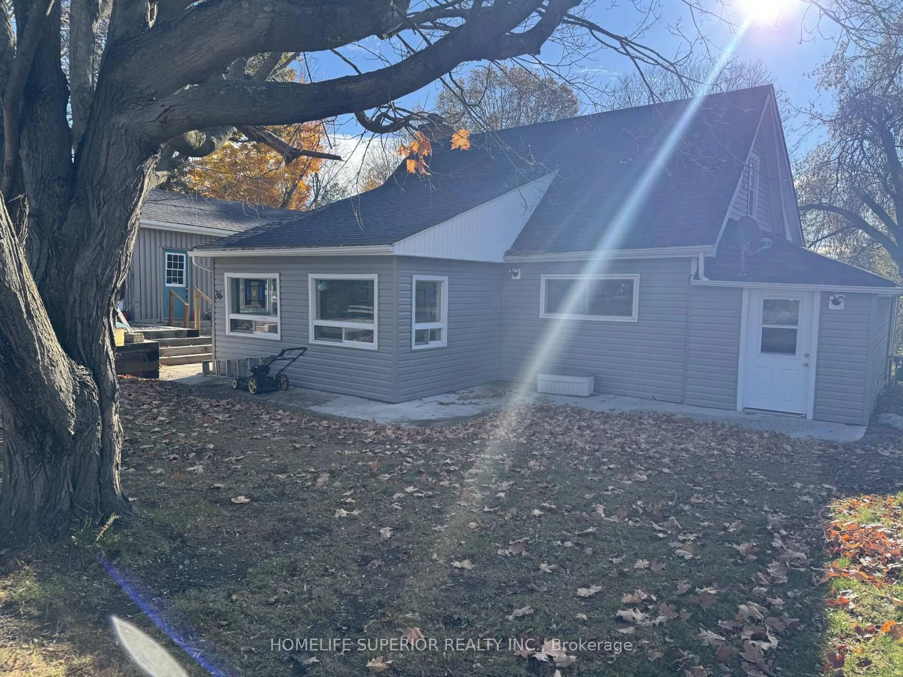 A pic from outside/outdoor area/front of a property/back of a property/a pic from drone, street for 36 Madoc St, Limoges Ontario K0K 2M0