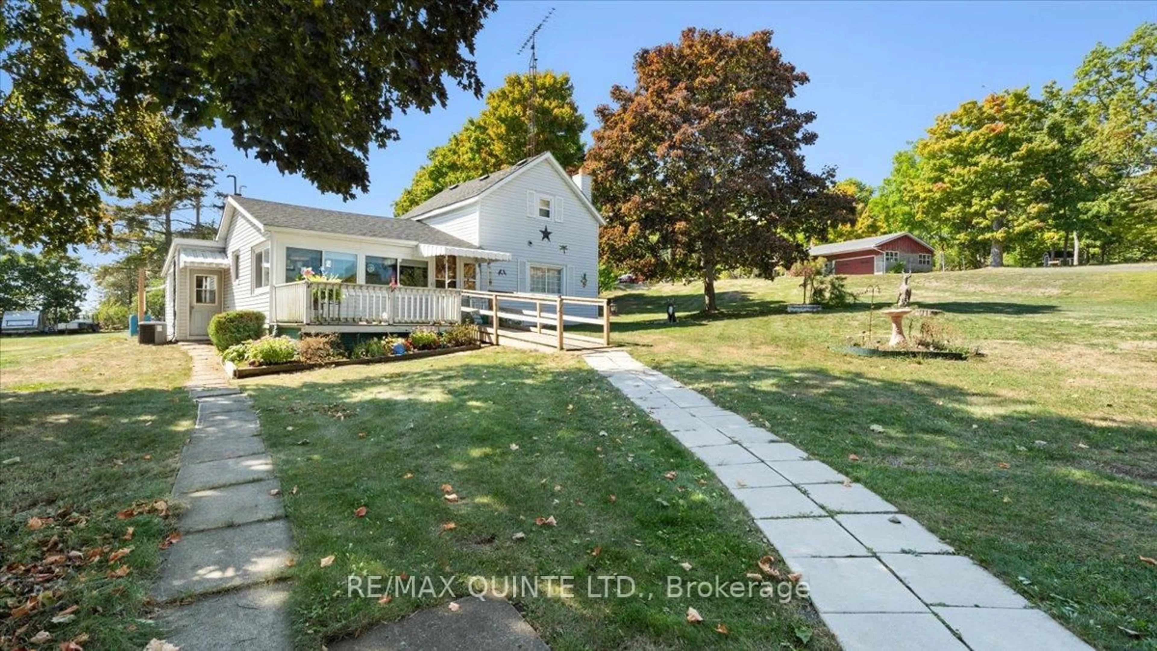 A pic from outside/outdoor area/front of a property/back of a property/a pic from drone, water/lake/river/ocean view for 2338 County Road 8, Prince Edward County Ontario K0K 2T0