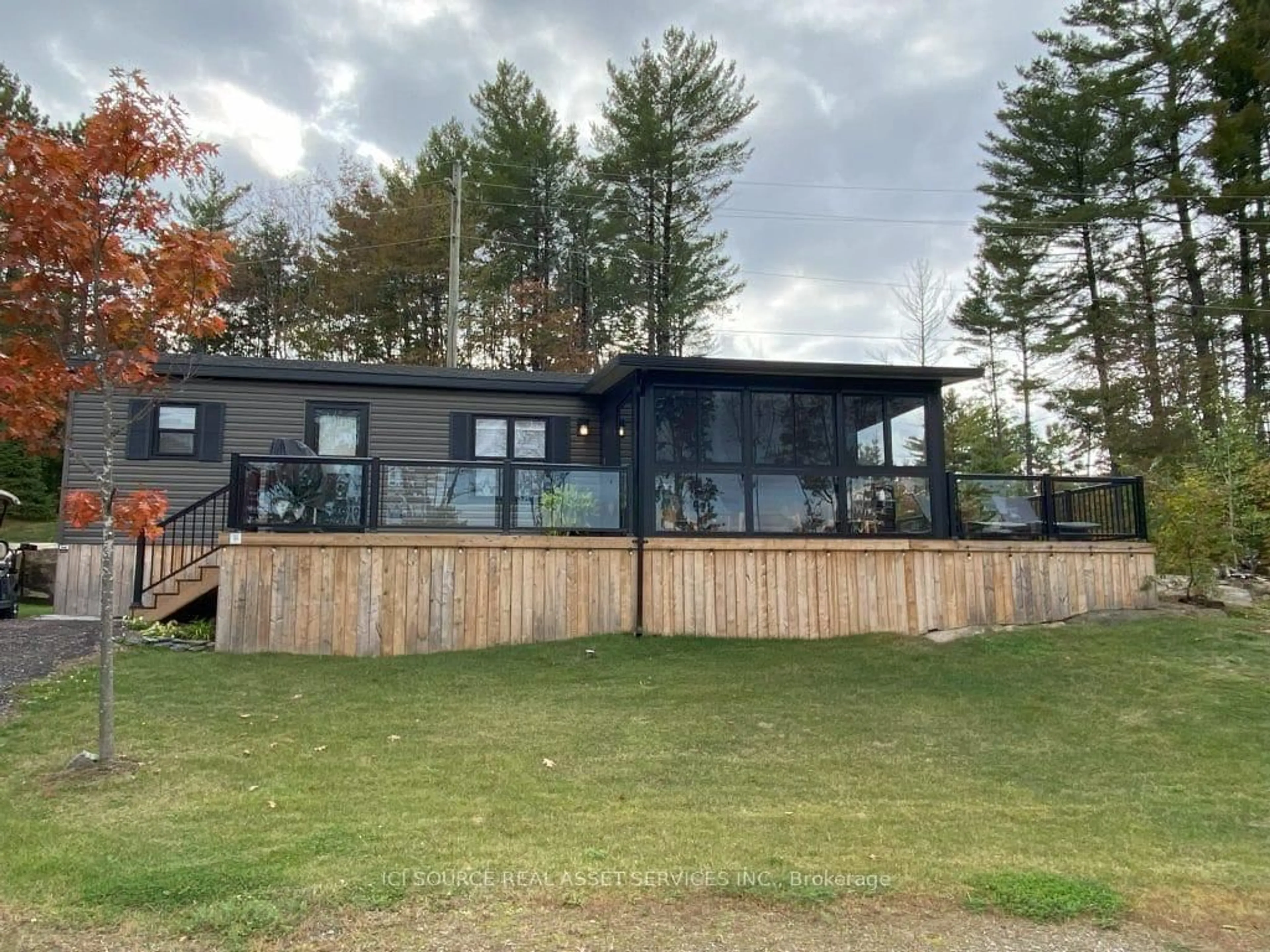 A pic from outside/outdoor area/front of a property/back of a property/a pic from drone, water/lake/river/ocean view for 1047 Bonnie Lake Camp Rd #BBT098, Bracebridge Ontario P1L 1W9
