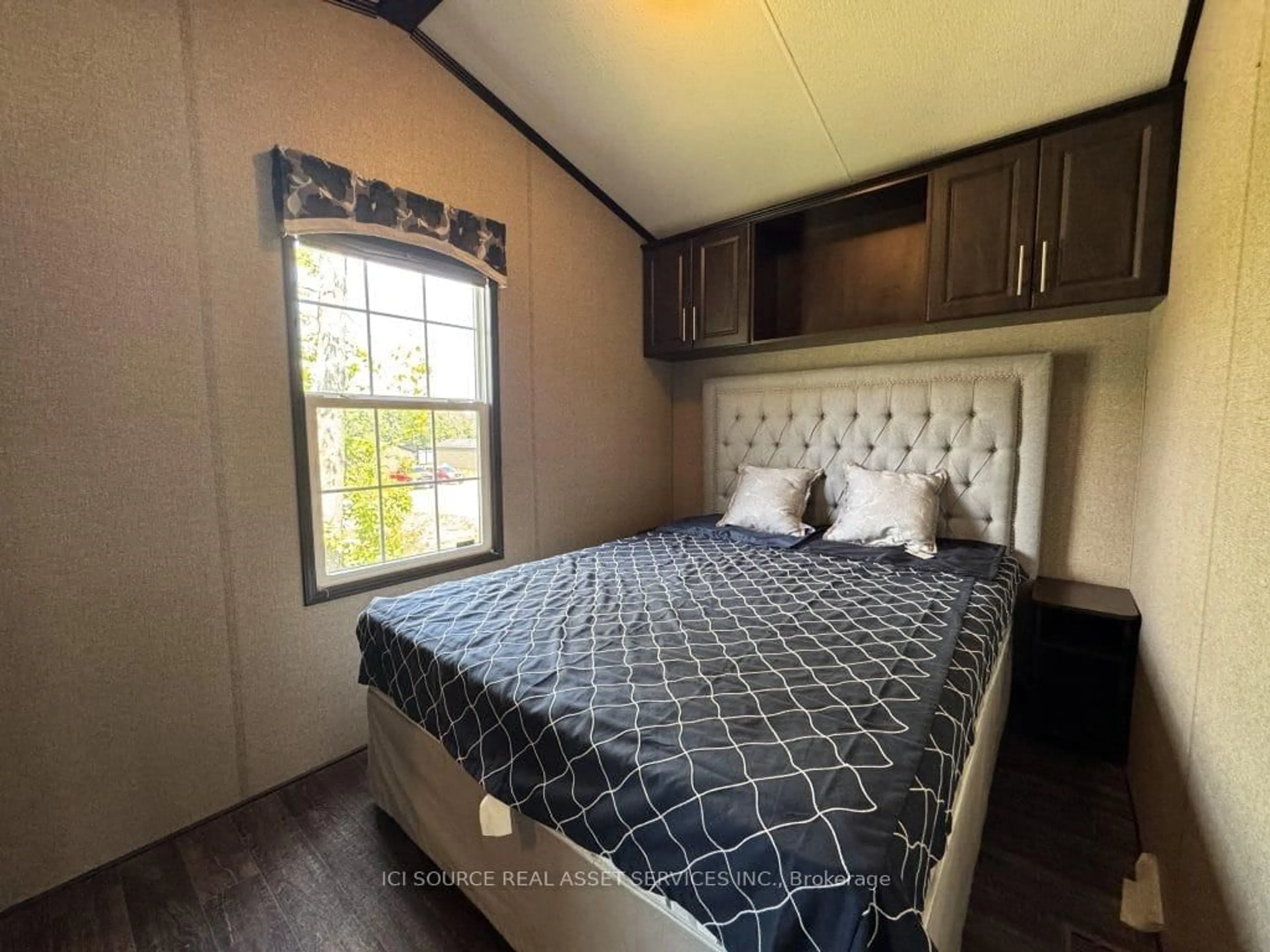Bedroom with bed, wood/laminate floor for 1235 Villiers Line #SAL024, Otonabee-South Monaghan Ontario K0L 2G0