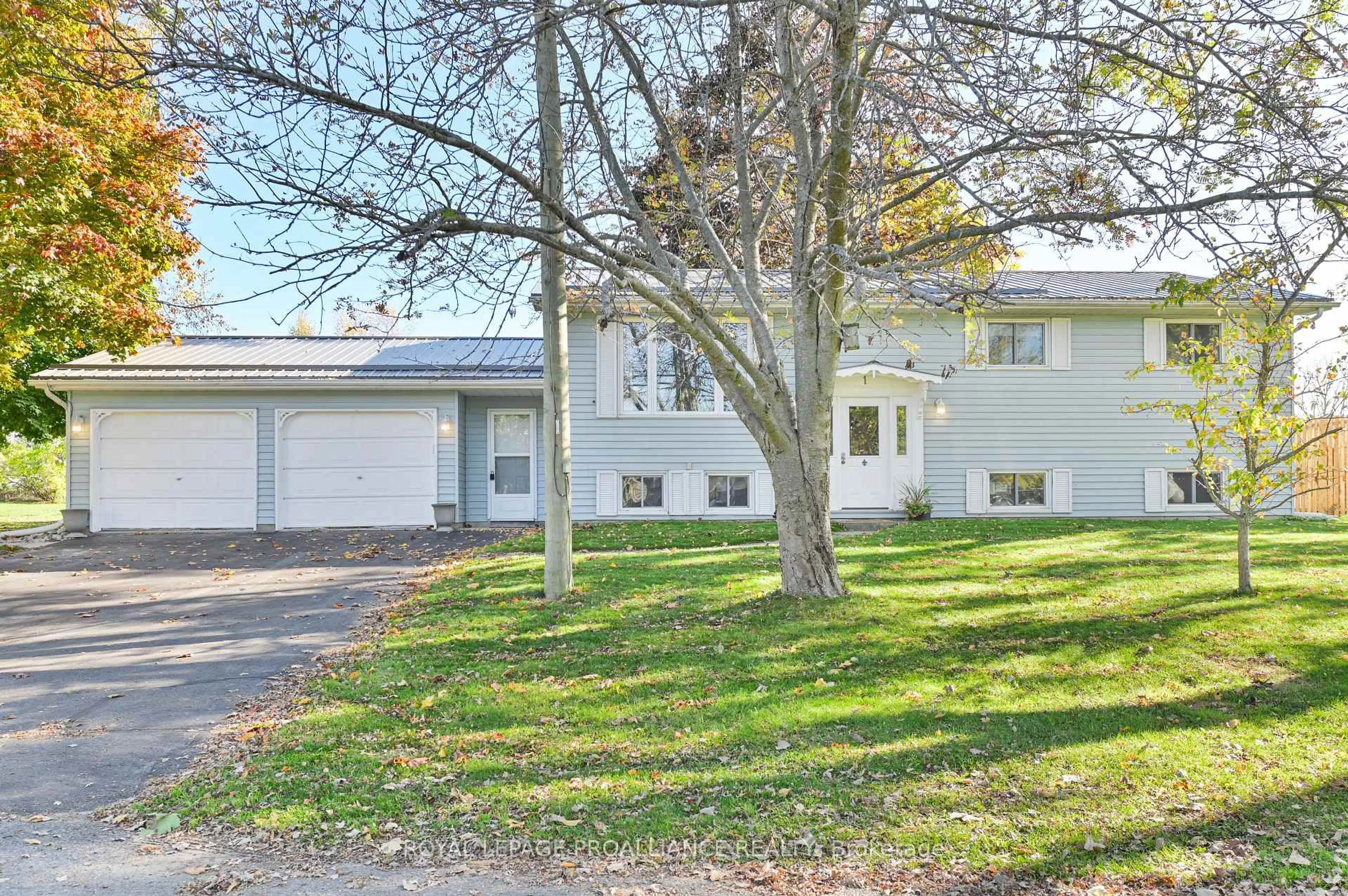 Home with vinyl exterior material, street for 1 Queen St, Brighton Ontario K0K 1H0