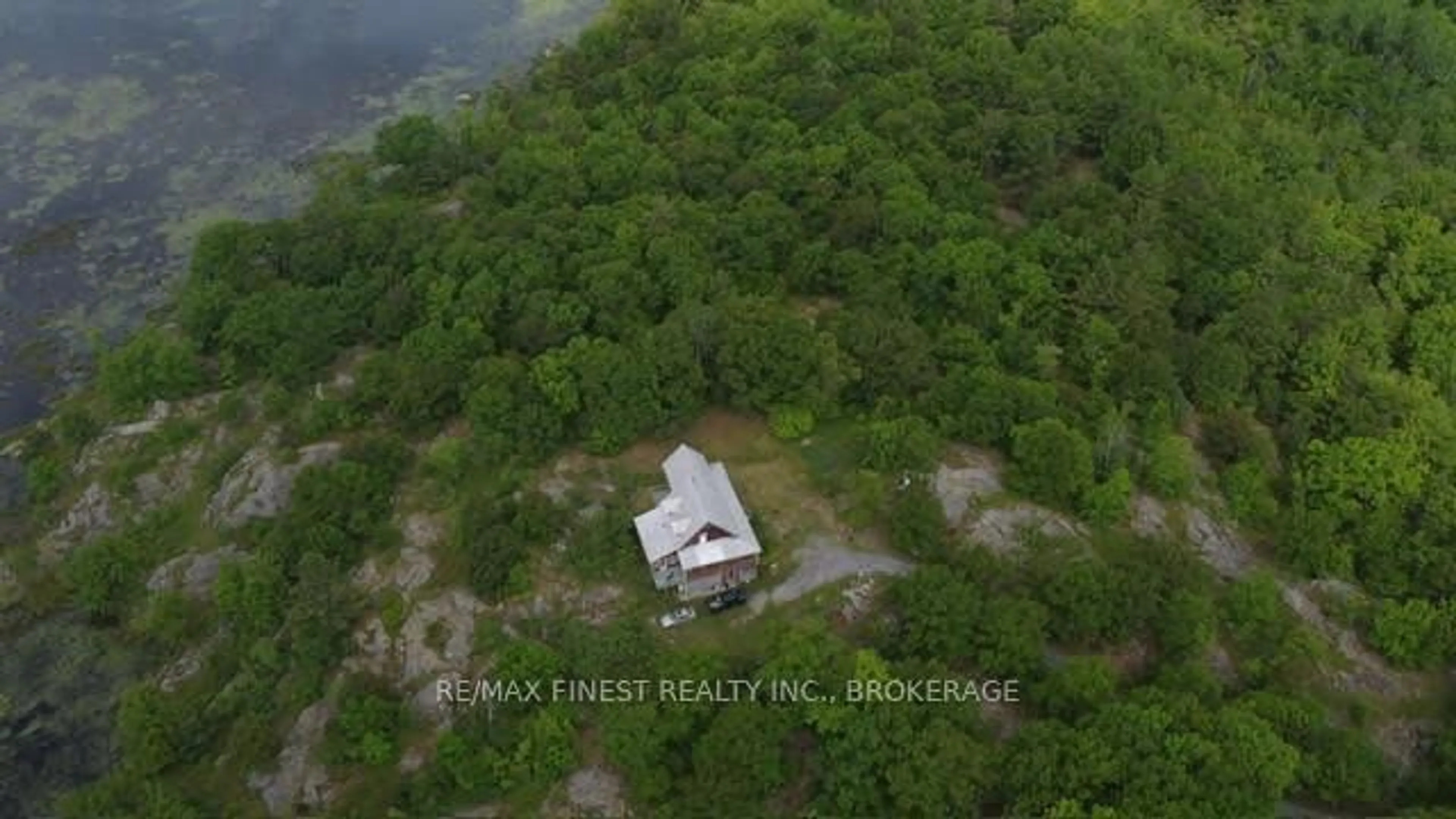 A pic from outside/outdoor area/front of a property/back of a property/a pic from drone, water/lake/river/ocean view for 1146 Fourth Lake Rd, Parham Ontario K0H 2K0