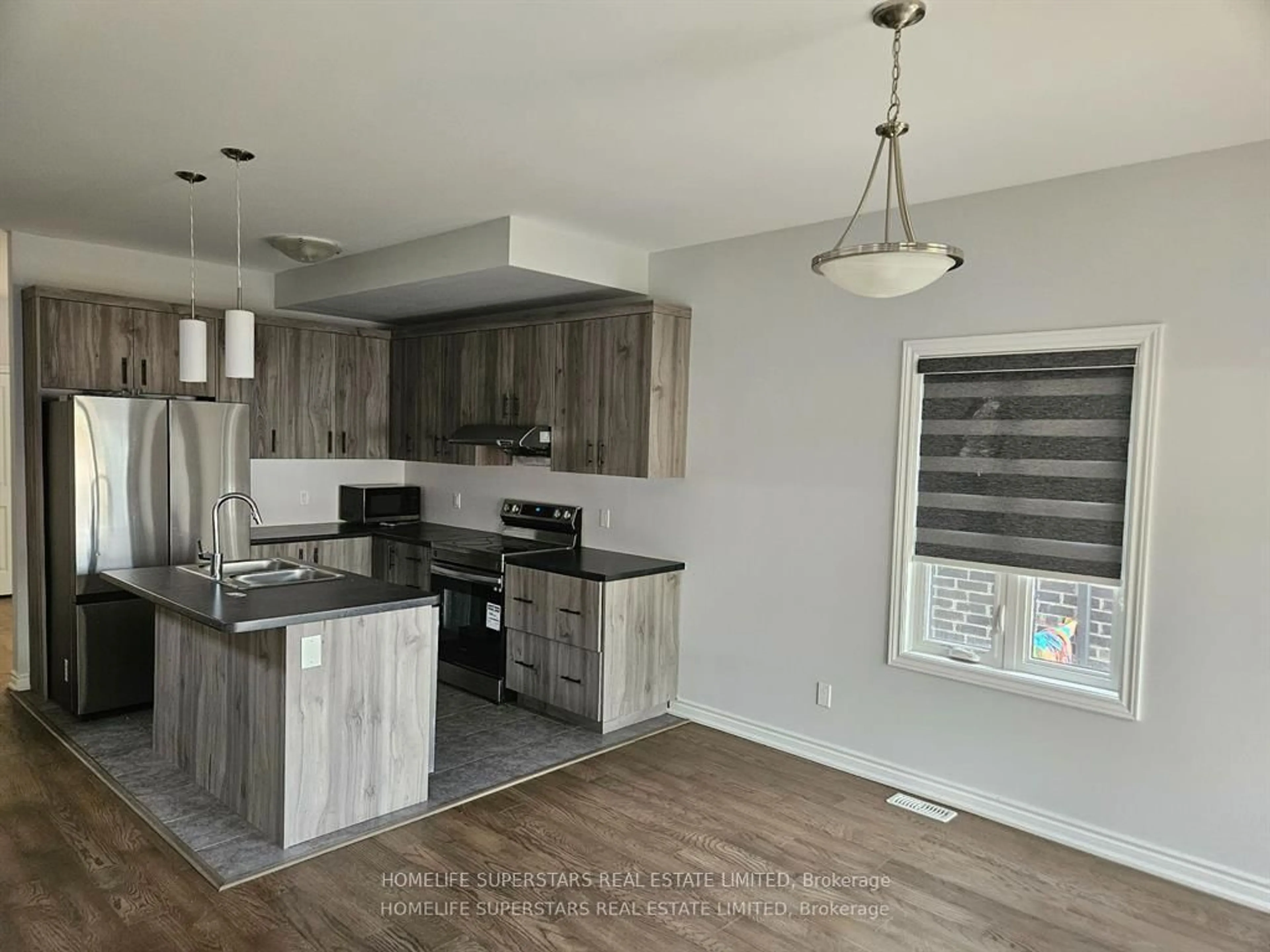 Open concept kitchen, wood/laminate floor for 68 Mclaughlin St, Welland Ontario L3B 0J8