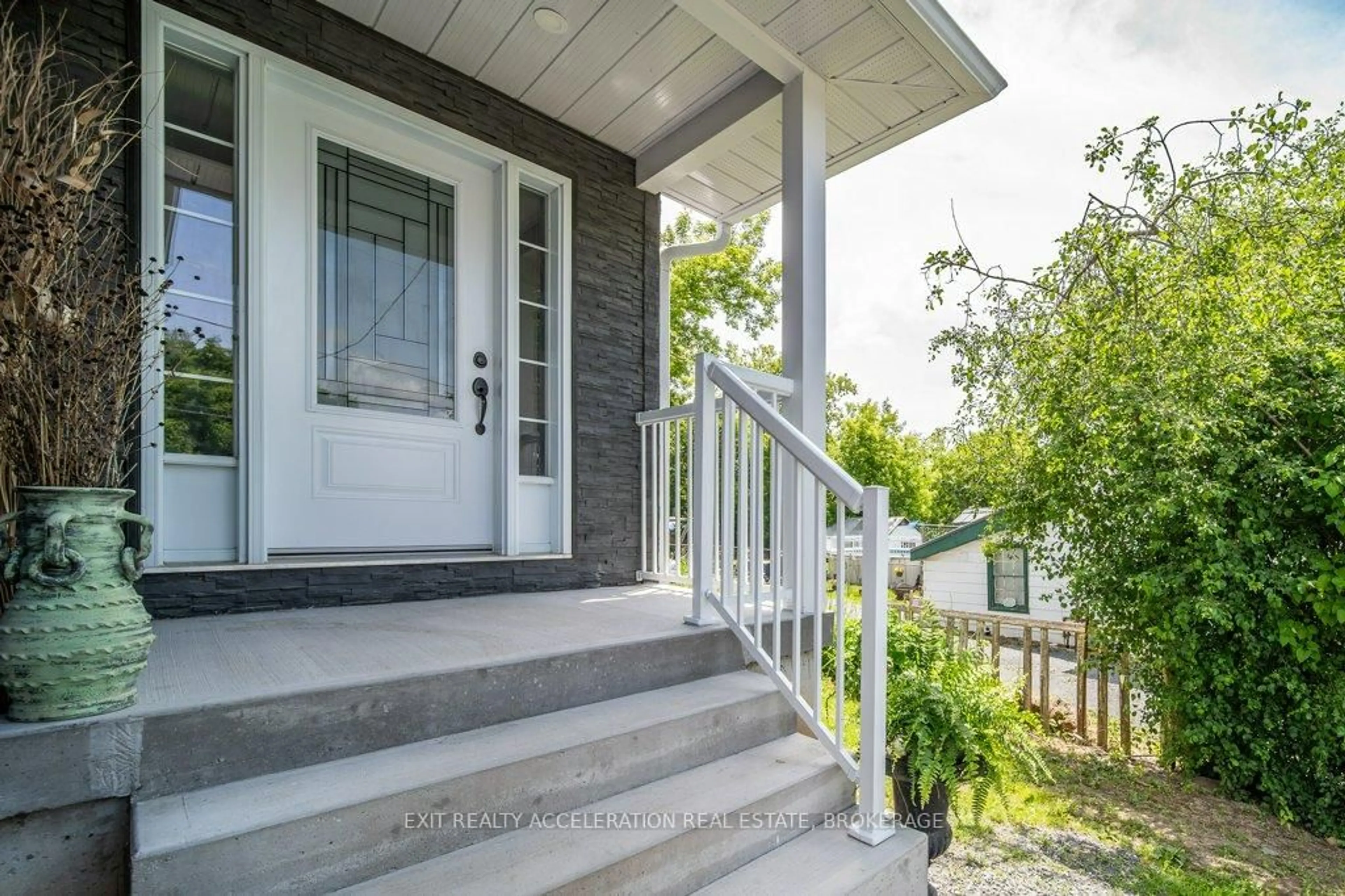 Home with vinyl exterior material, street for 100 Palace Rd, Greater Napanee Ontario K7R 3B3