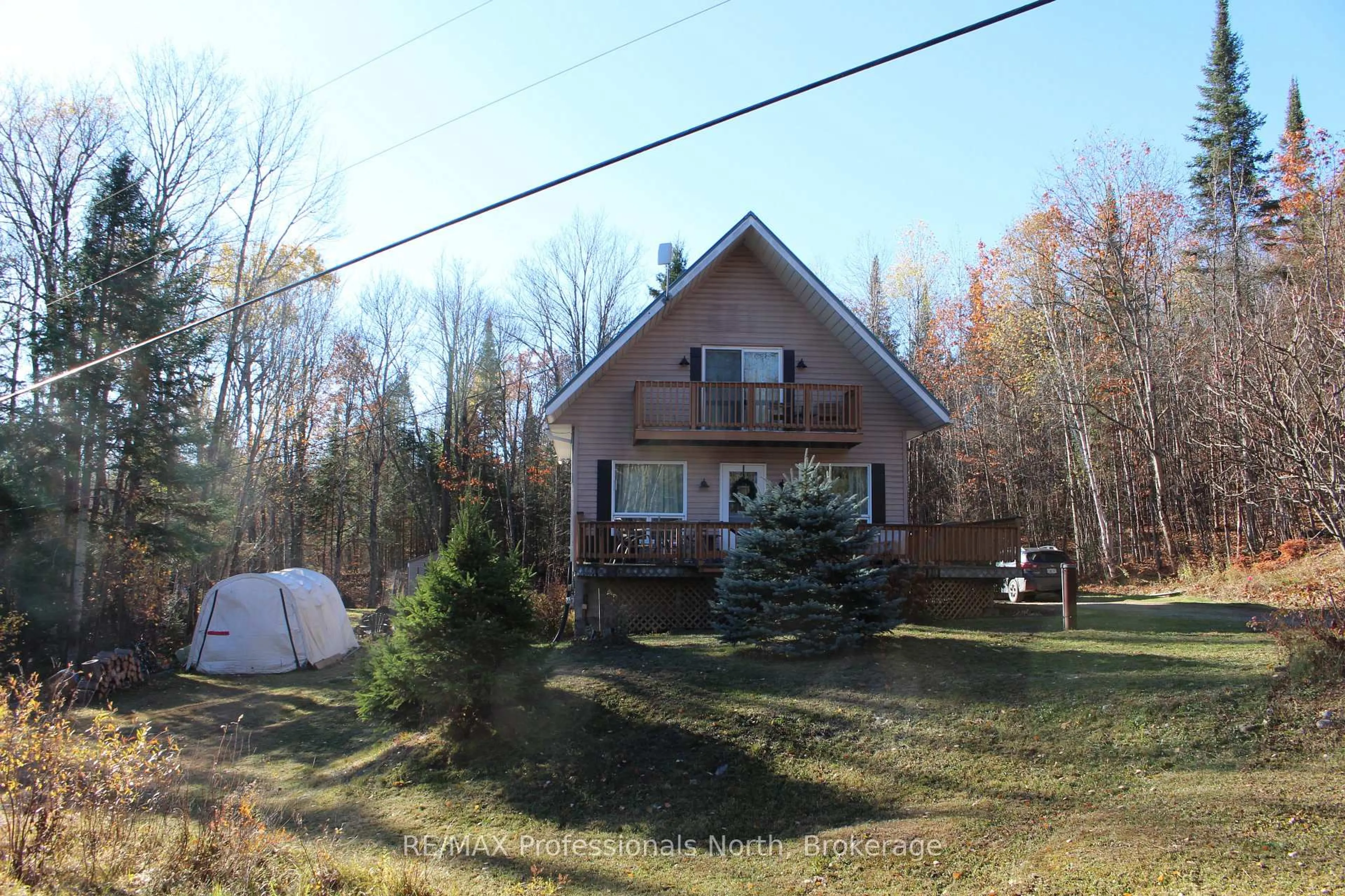 A pic from outside/outdoor area/front of a property/back of a property/a pic from drone, street for 1121 Old Donald Rd, Dysart et al Ontario K0M 1S0