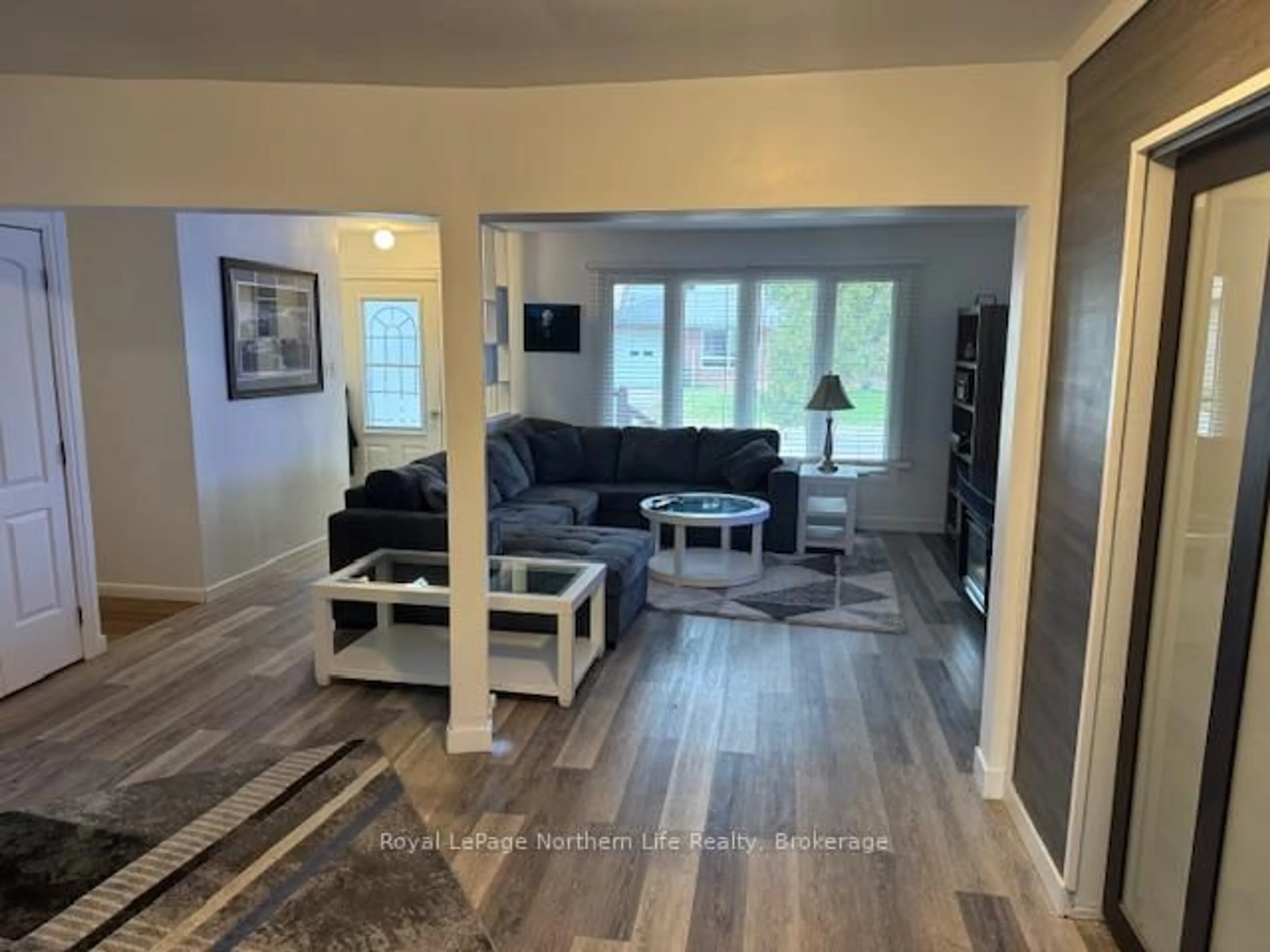 Living room with furniture, wood/laminate floor for 44 Desgrosielliers St, West Nipissing Ontario P2B 3B6
