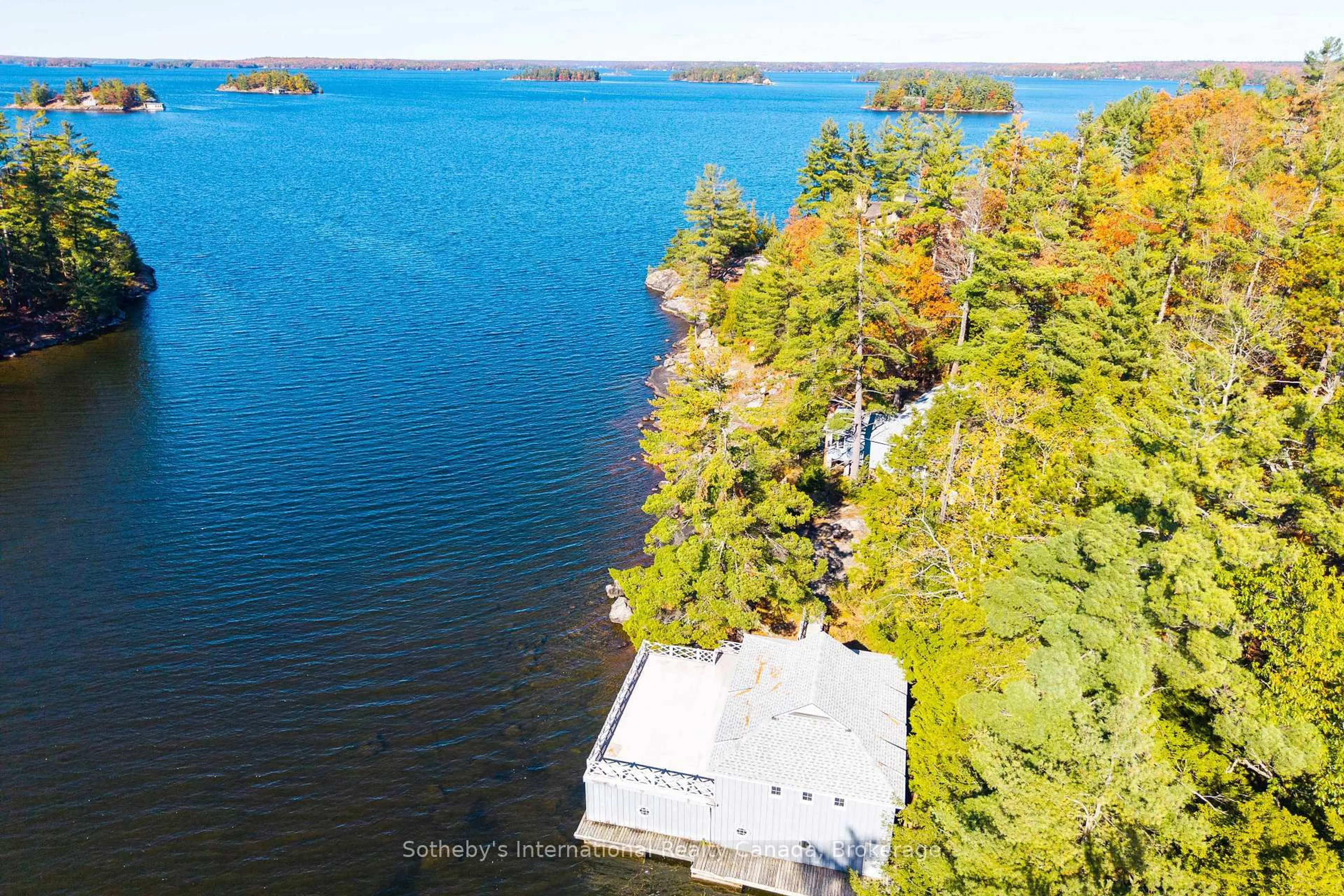 A pic from outside/outdoor area/front of a property/back of a property/a pic from drone, water/lake/river/ocean view for 1-1076 Birch Point Rd, Gravenhurst Ontario P1P 1R1