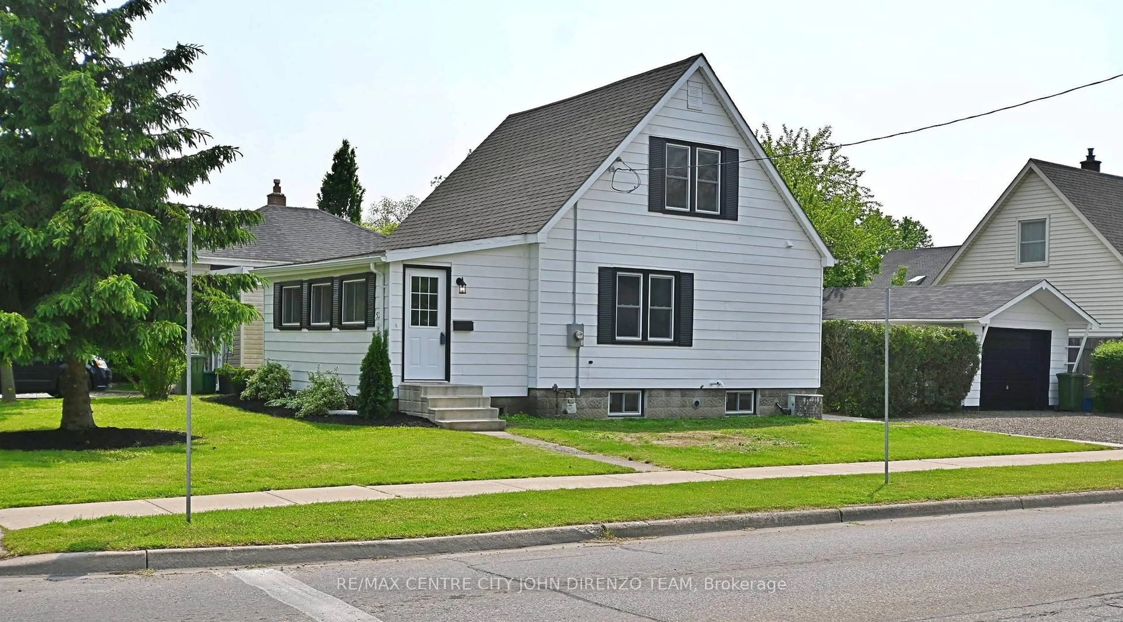 Home with vinyl exterior material, street for 52 Woodworth Ave, St. Thomas Ontario N5P 3J8