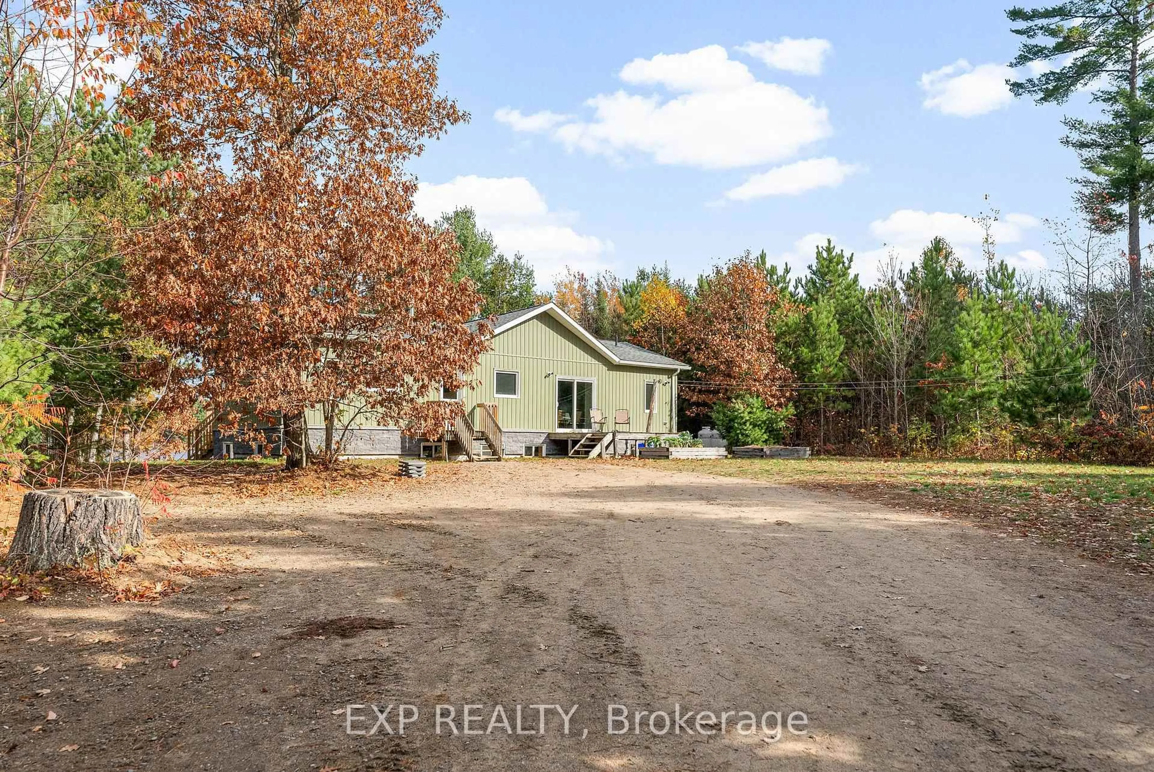 A pic from outside/outdoor area/front of a property/back of a property/a pic from drone, unknown for 79 Warbler Way, Combermere Ontario K0J 1L0