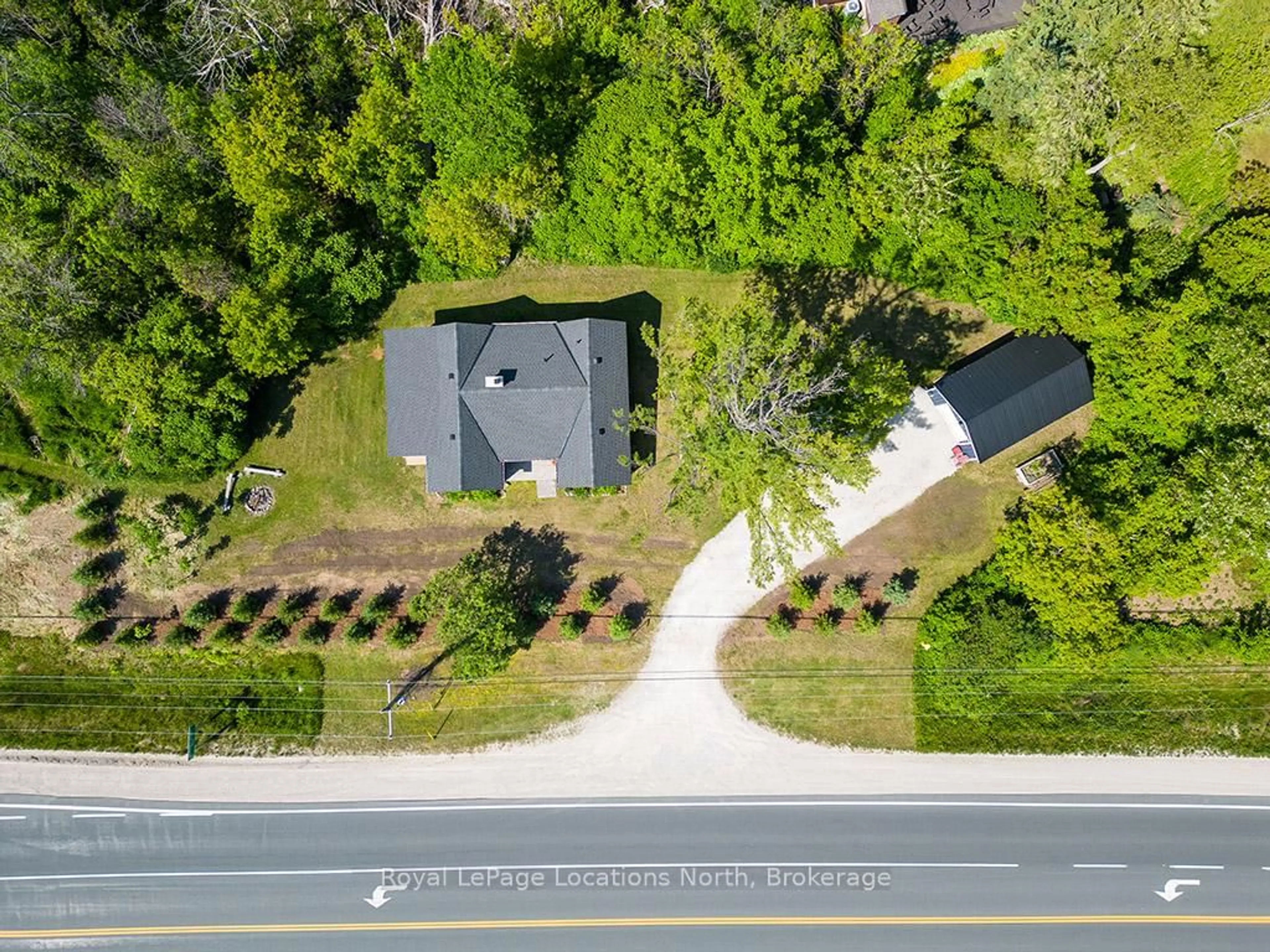 A pic from outside/outdoor area/front of a property/back of a property/a pic from drone, street for 209009 26 Highway, Blue Mountains Ontario N0H 1J0