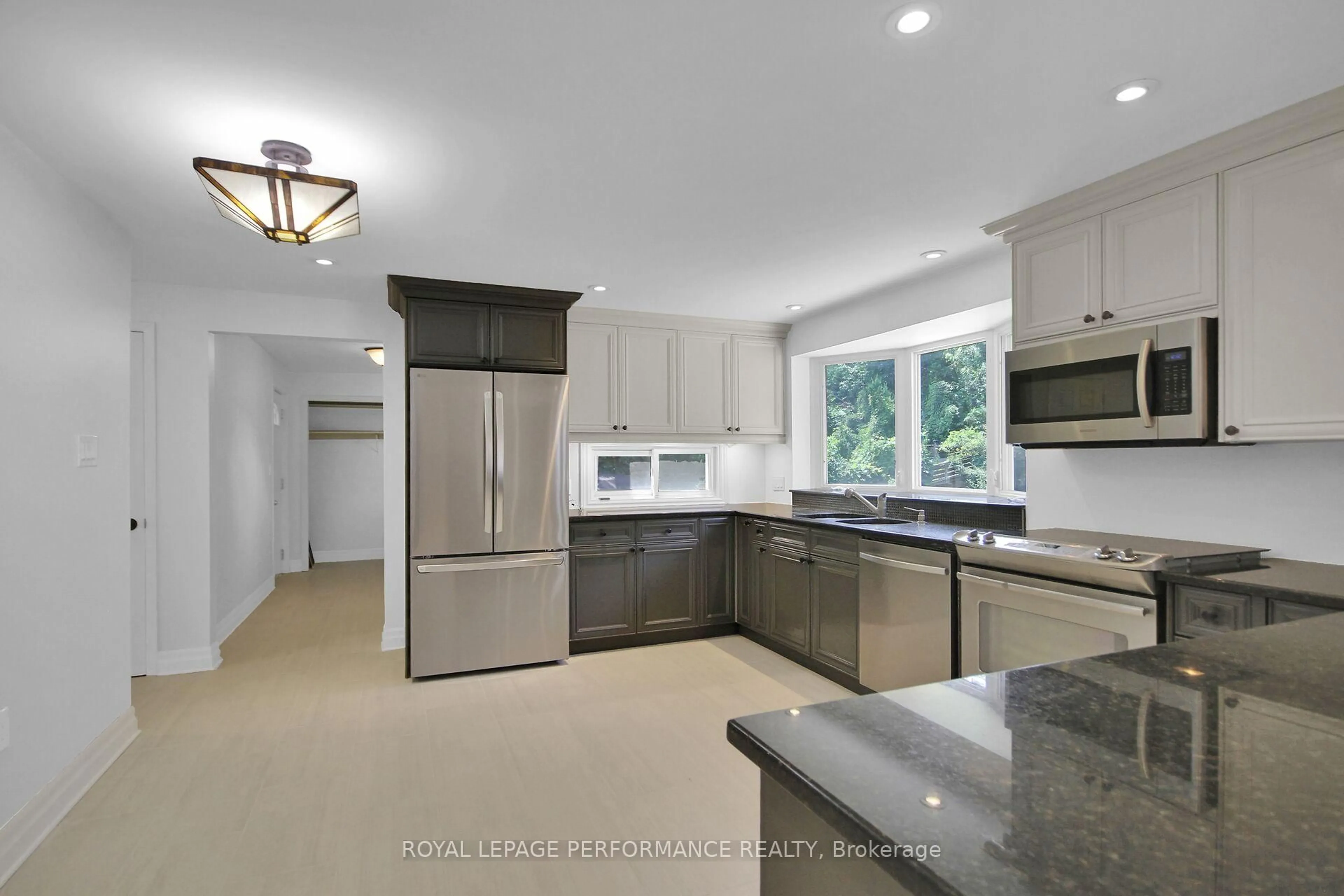 Open concept kitchen, ceramic/tile floor for 82 Queensline Dr, Ottawa Ontario K2H 7J5