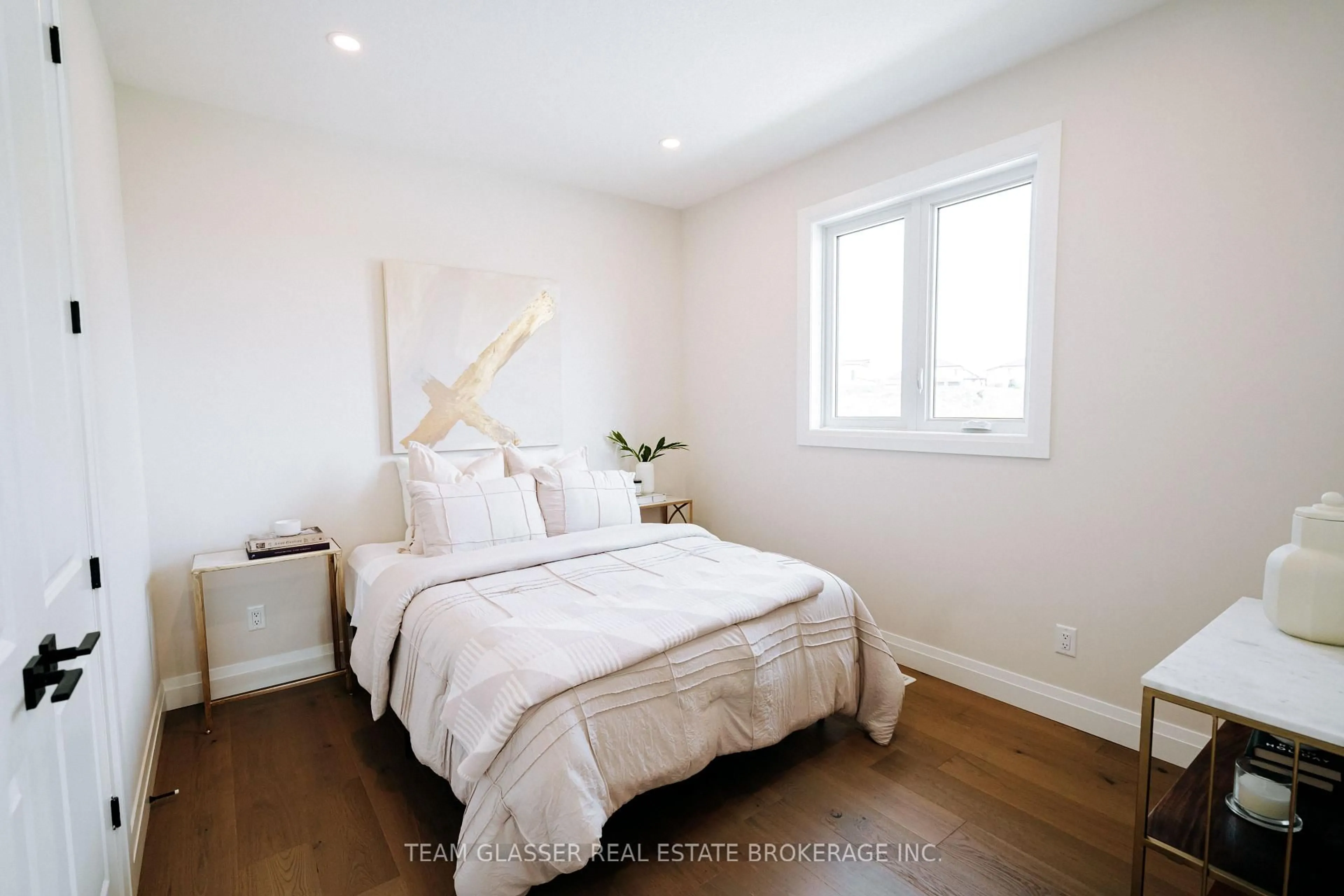 Bedroom with bed, wood/laminate floor for 64 Allister LOT 99 Dr, Middlesex Centre Ontario N0L 1R0