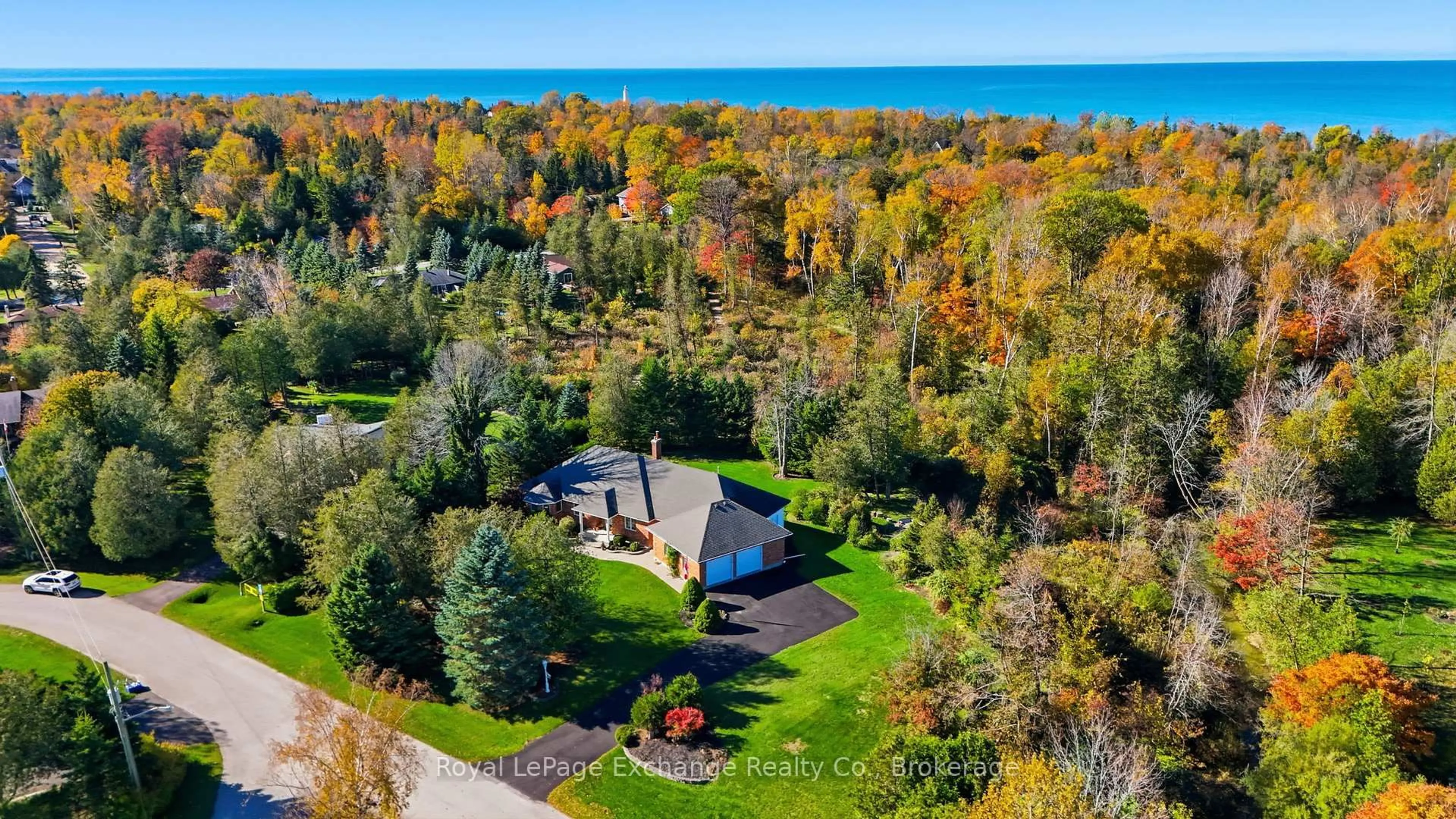 A pic from outside/outdoor area/front of a property/back of a property/a pic from drone, water/lake/river/ocean view for 115 Deerhurst Dr, Huron-Kinloss Ontario N2Z 2X3